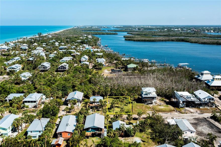 Welcome to the kind of ISLAND LIFESTYLE most people only experience on vacation — except this time, it can be yours to build. On the secluded shores of Little Gasparilla Island, this 100’ x 50’ cleared and build-ready lot offers the rare opportunity to create your custom retreat on a bridge-less barrier island accessible only by boat. Tucked near the end of Bay Street and framed by palm trees, the setting feels serene, peaceful, and perfectly positioned for true coastal living. Enjoy convenient bay access just steps away at the community dock (available with a low annual HOA cost) and take a short stroll to the epic beach access for miles of unspoiled Gulf shoreline. Here, you truly experience gulf-to-bay living - sunrise over the bay, sunset over the Gulf - all in one extraordinary location. This golf-cart-friendly community embraces a slower pace where neighbors wave, shelling is a daily ritual, and memories are measured in boat rides, fishing trips, and barefoot beach walks. No bridges. No traffic lights. Just island air and endless horizon. If you’ve been waiting for the right canvas to design your dream home in a setting that feels worlds away — this is your chance to claim your piece of island paradise and start living the life others only dream about.