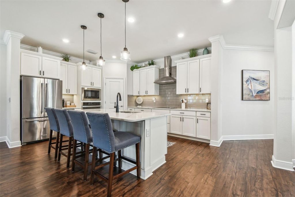 Photo of 612 Ozona Village Dr, Palm Harbor, FL 34683 (MLS # TB8380862)
