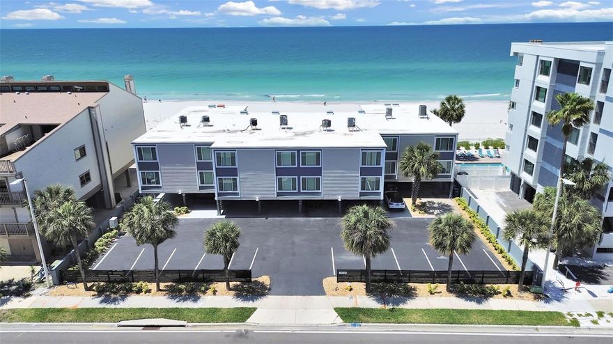 Wake up to the sound of waves and end every day with a perfect sunset—this direct Gulf-front corner townhome condo offers the ultimate beachfront lifestyle. Perfectly positioned on the sand, this rare corner unit features a covered carport for two vehicles, an additional assigned parking space, and a unique covered outdoor entertainment area with direct beach access—ideal for hosting or simply relaxing after a day in the sun. A brick-paved extension leads seamlessly to the pool and beachfront, creating a true indoor-outdoor coastal living experience. Inside, the open-concept dining and great room is designed to maximize the breathtaking water views. The kitchen overlooks the main living space and is beautifully updated with quartz countertops, stainless steel appliances, and modern coastal white cabinetry (2020). The great room is filled with natural light, featuring a triple sliding glass door and picture window framing stunning Gulf views—so you can enjoy sunsets right from your sofa. This home offers two private balconies, both overlooking the Gulf, providing front-row seats to year-round sunsets. Additional upgrades include electric roll-down hurricane shutters on the sliders, impact windows, and a newer A/C system (2020) with a 10-year warranty. Located just across the street from a nature park with a scenic boardwalk along the Intracoastal Waterway—perfect for spotting manatees and local wildlife—and only one minute from a public boat ramp, this property offers the best of both beach and boating lifestyles. The beach trolley stop is conveniently nearby, and you’re just a short stroll from popular local favorites like Salt Rock Grill, Indian Shores Coffee Co., Mahuffer’s, and Voilà Mercie. With a 30-day minimum rental policy, this property also presents an excellent opportunity for income potential or extended stays.NO hurricane flood damage in living area, Milestone and reserve study complete for added peace of mind. Whether you’re looking for a full-time residence, vacation getaway, or investment property, this beachfront gem delivers unmatched views, location, and coastal charm.