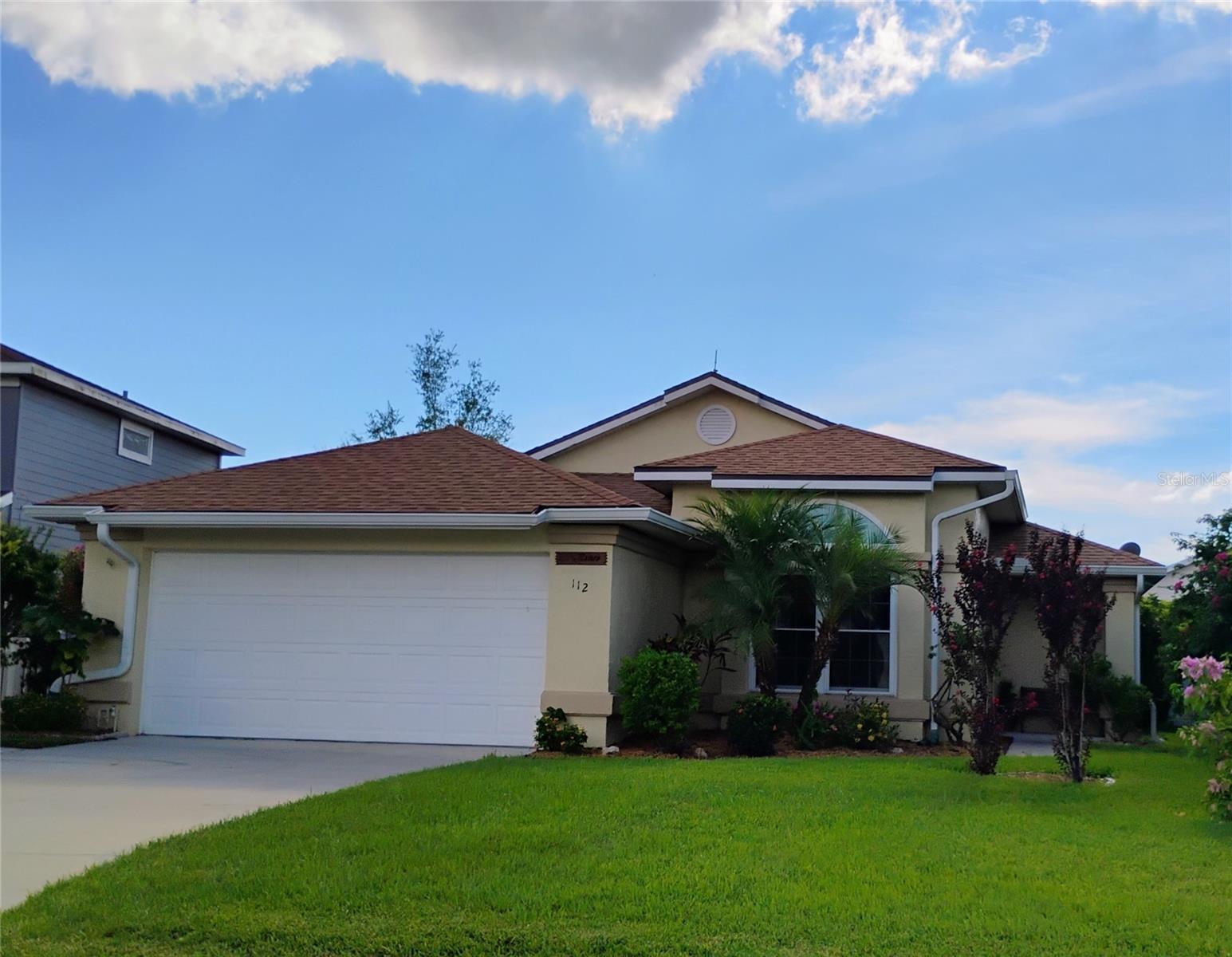 This beautifully maintained 3/2 home offers comfort, space, and great value with no HOA, no CDD, LOW Taxes and a 3 year old ROOF. As you enter, you'll find a versatile living room with a large window—perfect as a formal dining or sitting area. The spacious family room features vaulted ceilings and sliding doors that open to a covered, screened-in patio for year-round outdoor enjoyment. At the heart of the home is an open kitchen with quartz countertops, stainless steel appliances, ample cabinetry, and a movable center island for flexible use. A pocket door off the kitchen reveals a laundry room with its own exterior access. The split-bedroom layout includes a large primary suite with a walk-in closet. Outside, the well-kept front yard includes an added concrete sidewalk along the side of the home. Conveniently located near great schools, shopping, dining, and major highways, this home combines peace and practicality in a great Kissimmee neighborhood.