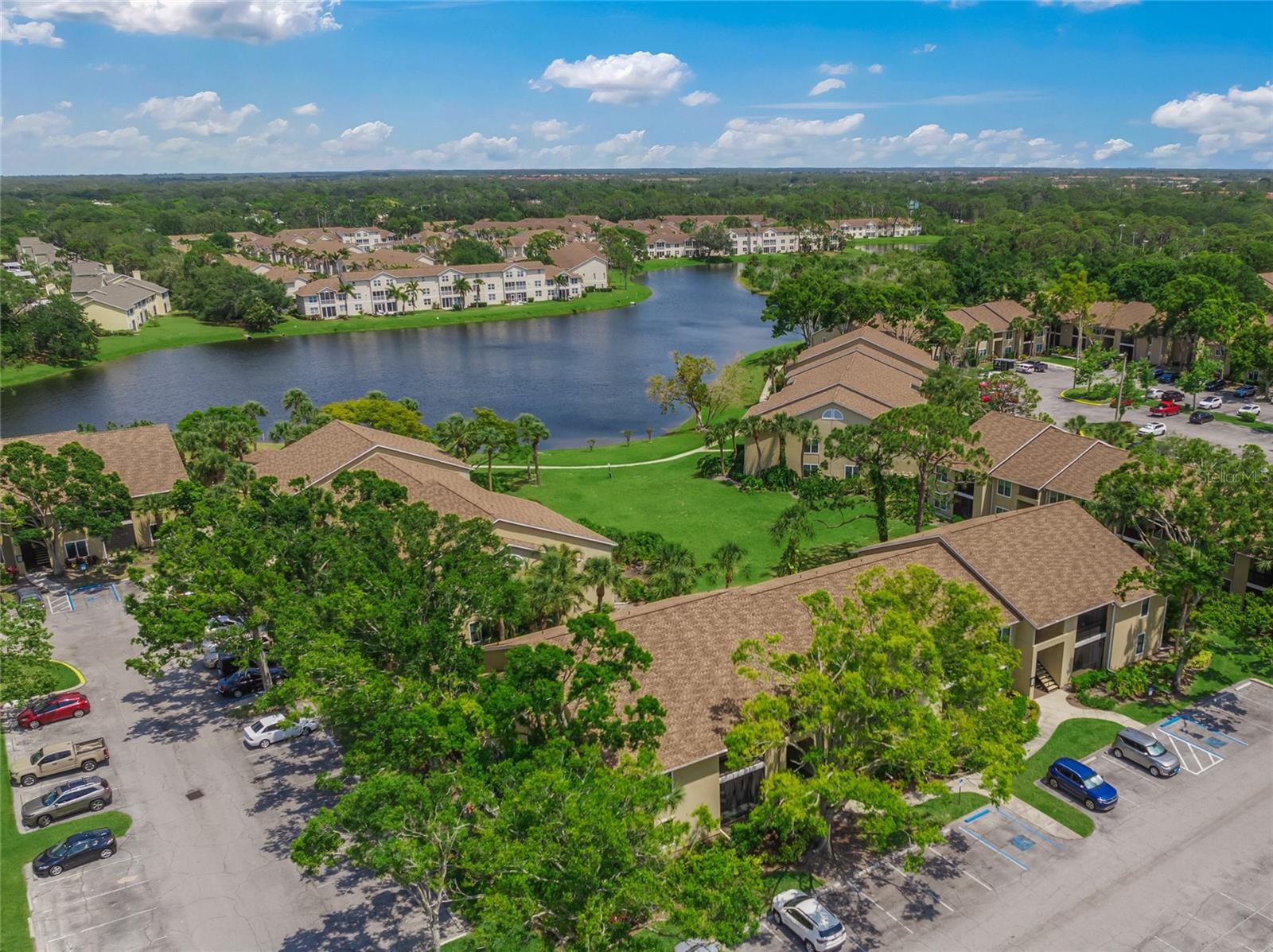 Move in ready! Best value in the heart of Palmer Ranch- Sarasota! This updated GROUND FLOOR END UNIT offers 2 bedrooms and 2 bathrooms with a thoughtful split floor-plan that provides both privacy and functionality. Freshly and professionally painted throughout in a soft neutral white, the space feels bright and inviting. A brand-new hot water heater has been installed, and both tub-shower combinations have been professionally renovated for a clean, refreshed look.
The kitchen has been upgraded with GRANITE countertops, new cabinetry, and a chef-style faucet and sink. It also features a convenient pass-through bar to the dining room and opens directly to the living area, creating a seamless flow for entertaining and everyday living. The entire condo is adorned with tile flooring, offering both durability and ease of maintenance.
The master ensuite includes granite countertops, new cabinetry, a renovated tub-shower combination, a makeup vanity, and a spacious walk-in closet. It also offers direct access to the screened-in patio, which includes a very large closet ideal for storing beach gear, bicycles, and more. The guest ensuite also has direct access to a beautifully updated bathroom featuring granite countertops, upgraded cabinetry, and renovated tub-shower combination.
The entire complex has undergone a magnificent renovation, including brand-new roofs, stucco, stairwells, **hurricane impact windows** fresh exterior paint, updated trim, and more. Community amenities include two pools (one being completely renovated right now) spa, fitness center, tennis courts, basketball court, picnic and grill area, and a dock on a serene pond. With newly lowered HOA fees and NO special assessments, this property offers exceptional value in a prestigious Sarasota location.
Situated just six miles from the world-renowned Siesta Key Beach, and within walking distance to the Legacy Trail, Publix, Target, Costco, a movie theater, and a fabulous YMCA, this condo is perfectly positioned for convenience. Only ten miles from downtown Sarasota—known for its opera, ballet, symphony, and chef-owned restaurants—this home is ideal as a part-time seasonal residence or a full-time base for enjoying the sunny Sarasota lifestyle.