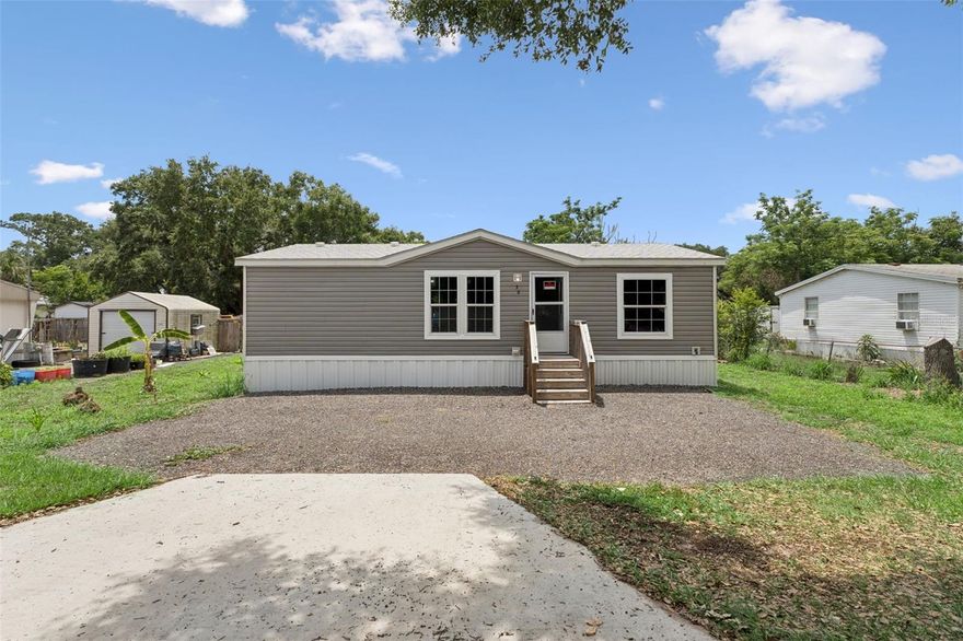 Manufactured in 2024 and still showing like new, this move-in ready home offers a clean, modern feel without the wait or uncertainty of new
construction. With only one owner since being placed onsite, the home has been lightly lived in and well maintained, making it a great option for a primary residence, seasonal retreat, or anyone looking for a newer home with low-maintenance living in mind. Inside, the split floor plan provides both functionality and privacy, with an open kitchen and living room combination that creates an easy everyday flow. The kitchen features stainless steel appliances along with modern finishes and touches throughout the home that give the space a fresh, updated look. The primary suite includes a private bathroom and spacious walk-in closet, while the second bedroom and full bathroom are positioned on the opposite side of the home for added privacy and flexibility for guests or a home office setup. All major systems were installed new when the home was placed onsite, including the septic system, well and pump, HVAC system, power pole, electric meter, and electrical panel. Conveniently located just off US-27 and a short drive from Eagle Ridge Mall, this home places buyers within easy reach of the fast-growing Lake Wales area.