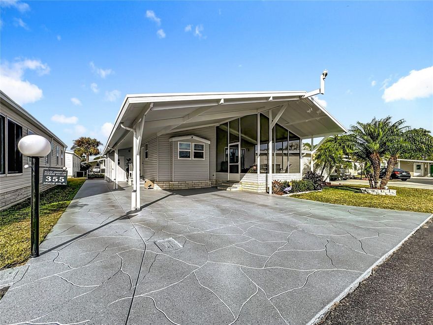 Welcome to this beautifully updated, tastefully decorated home that delivers the best of Florida living—inside and out. From the moment you step in, you’ll notice the bright, open layout and the stylish upgrades throughout, creating a home that feels both welcoming and move-in ready.

Seller has updated all the plumbing underneath the home. No worries for a buyer to have to deal with. 

Stunning Updated Kitchen + Open Concept Living
The completely updated kitchen is a true showpiece, featuring a peaceful and modern color design that feels fresh, clean, and timeless. With brand-new appliances and a layout that flows perfectly into the dining and living areas, this space is ideal for entertaining, everyday living, and everything in between.

Spacious Living Room with Elegant Finishes

The spacious living room offers an airy, open feel with newly painted walls and crown molding throughout the home, adding an elevated and polished touch. The open-concept design makes the home feel larger, brighter, and incredibly inviting

Florida Room – Your Private Relaxing Retreat
Just off the living room, step into the screened-in Florida room, the perfect space to unwind with a morning coffee, enjoy a good book, or host friends for a casual evening. This bonus space brings the outdoors in while keeping things comfortable and breezy year-round.

Stylish Bedrooms + Beautifully Updated Bathrooms
This home offers thoughtfully updated spaces with tasteful finishes and a calm, neutral color palette.

Guest bedroom: freshly painted and nicely decorated, ready for visitors or a home office

Main bedroom and en suite: painted in a beautiful, neutral tone for a peaceful retreat

Guest bathroom: tastefully updated with granite countertops

Main bathroom: completely updated and absolutely stunning, featuring a modern Marvel shower with a gorgeous sliding door, trimmed with sleek hardware for a high-end designer look

Outdoor Living + Fresh Curb Appeal
This home offers outstanding outdoor features designed for comfort and convenience:
Covered parking for two cars, plus an additional driveway
Driveway and sidewalk freshly painted and sealed within the last year

Storage shed out back for tools, golf gear, or extra storage

Relaxing backyard sitting area—a perfect spot for morning coffee or happy hour, with plenty of space for chairs and outdoor seating while enjoying the Florida sunshine

Community Amenities (Lily Lake Golfing RV Resort)


Enjoy a beautifully maintained community with a very reasonable POA of $206/month, which includes:

Cable

Internet

Yard maintenance

Garbage pickup 3 days a week



Plus, you’ll love the lifestyle amenities:

Community center

Pickleball courts

Swimming pool

Hot tub

Shuffleboard

Cornhole

Plenty of seasonal activities, including dances, bingo, card games, and more



Lily Lake takes pride in its beautifully kept grounds—and don’t forget the nine-hole golf course, with the option to buy into the golf course as well