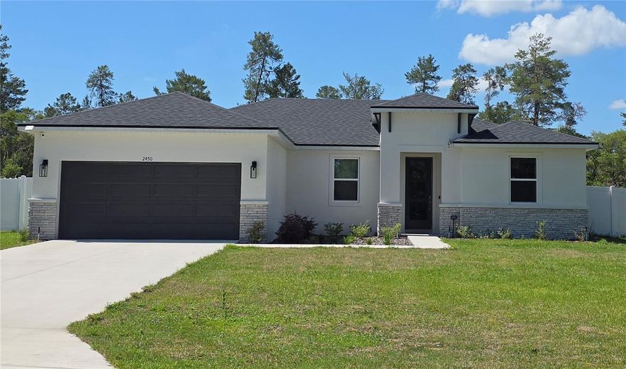 Brite Sunrise Model by Brite Homes! Highly sought after Marion Oaks community! This beautifully single-story Ranch-style home sits on a generous 0.71-acre (3/4-acre) lot with no back neighbors, offering incredible privacy with a vinyl fence and room to enjoy Florida’s outdoors. Built in 2025 with durable concrete block (CBS) construction, stucco and stone accents, and a concrete slab foundation, this home is move-in ready. 

Inside, the 1,787 sq ft open-concept floor plan features 4 bedrooms, 2 bathrooms, and a split-bedroom layout perfect for families or guests. Soaring 9’4” ceilings, luxury tile plank flooring throughout, and an abundance of natural light creates a bright, airy feel. The chef’s kitchen shines with 36” real wood cabinets, elegant quartz countertops, stainless steel appliances, and a spacious island—ideal for entertaining.  The master bedroom offers a large walk-in closet; this primary suite provides a true retreat. 

Energy efficiency is built in double-pane low-E windows to help control indoor temperature and reduce noise pollution, LED lighting, and a high-performance 16 SEER HVAC system deliver comfort and savings. This home achieves a strong HERS score of 53, translating to lower utility bills year-round. Outside, enjoy designer landscaping and a full irrigation system on this oversized irregular lot. The north-facing front elevation provides balanced light, while the open backyard is perfect for a future pool, garden, or simply relaxing under the stars. Additional highlights include a 2-car garage and modern finishes throughout. 

No HOA. No CDD. Just low-maintenance living with county-maintained roads and the convenience of the Marion Oaks MSTU for neighborhood services. Located in desirable Ocala, FL 34473, you’re minutes from shopping, dining, hospitals, and major highways, yet tucked away in a peaceful setting. This is new-construction living at its best—modern, efficient, and worry-free. Don’t miss your chance to own this exceptional home!