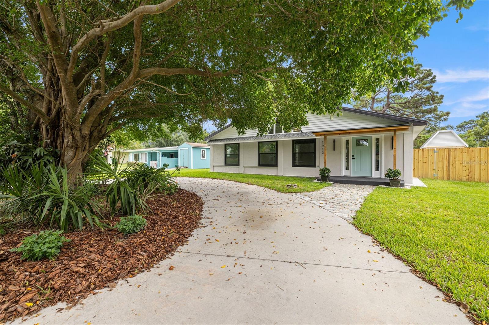 Welcome to this beautifully renovated 3-bedroom, 2-bathroom modern farmhouse, perfectly situated in one of the area’s most desirable neighborhoods with direct views of the lake and just minutes from schools and a scenic park. This move-in ready home boasts an open floor plan with soaring ceilings and abundant natural light, complemented by a brand-new roof, appliances, energy-efficient windows, new doors inside and out, and a state-of-the-art HVAC system for year-round comfort. A spacious laundry room provides plenty of storage and functionality, while a charming brick wood-burning fireplace remains the centerpiece of the living space, blending the home’s modern updates with its original character. Outside, the large fenced-in backyard offers privacy and plenty of space for entertaining, while a versatile 10x10 shed with tall ceilings provides endless possibilities as a workshop, studio, storage, or even a guest retreat. Additional highlights include a circular driveway with ample parking and convenient access, plus close proximity to Pinellas County’s newest park, the Gladys Douglas Preserve. Combining modern convenience with timeless farmhouse charm, this property truly checks every box.