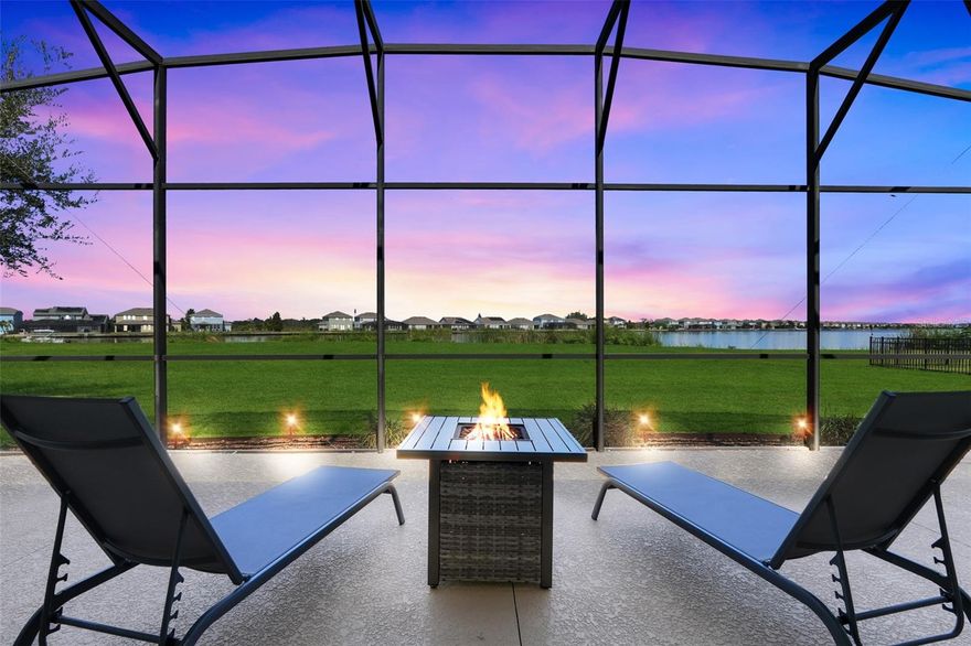 Welcome to this exceptional residence in the resort-style gated community of Waterside Pointe. Perfectly positioned on nearly half an acre (.46 acres) with expansive lake frontage, a rare find in this community. With over $60,000 in recent upgrades (2024), this home aims to please! All new light fixtures, crown molding, baseboards, exterior & interior paint (including ceilings), new screening, new faucet, new dryer, new hose valves, new vanity in the 2nd ensuite bathroom, new cabinet fixtures, and a high end motorized blind in the living room. 
Inside, a gracious entry introduces extended height ceilings, wood-like tile flooring, crown molding, 5.5 inch baseboards, and elegant lighting that sets the tone throughout.  A relaxing sitting room greets you as soon you enter. A bright formal dining room flows seamlessly into the open living area, where a coffered ceiling and crown molding frame stunning views of the water.
The gourmet kitchen features a large custom island with bar seating, 42-inch cabinetry topped with crown, granite countertops, and stainless-steel appliances, all designed with both function and style in mind. Sliding glass doors open to a 500 square foot screened lanai that extends the length of the home. Perfect for outdoor entertaining while overlooking the lake.
The spacious primary suite enjoys lake views, luxury vinyl plank flooring, a chandelier fan, and a spa-inspired bath with dual vanities, garden tub, walk-in shower with rain shower head, and a generous walk-in closet. A secondary en suite bedroom is positioned on the opposite side of the home, ideal for guests or multi-generational living, while two additional bedrooms share a well-appointed bath with a tub-shower combo. This home is not located in a flood zone, so flood insurance is not needed! 
Waterside Pointe residents enjoy exclusive access to resort amenities including a clubhouse, resort-style pool, fitness center, tennis, basketball, pickleball, and a community boat ramp with canal access to the Clermont Chain of Lakes.
With its expansive lot, refined finishes, and direct connection to lakefront living, this home offers the perfect blend of elegance, comfort, and lifestyle in one of Groveland’s most sought-after communities. Located just down the street from the Historic Downtown Shopping District where you'll also find dining, events, and night life. But that's not all! Waterfront Park Beach is also Downtown, including a boat ramp to launch your boat out on the Clermont Chain of Lakes. Don’t miss your opportunity to experience lakefront luxury in one of Groveland’s most prestigious communities. Call today to schedule your private showing.