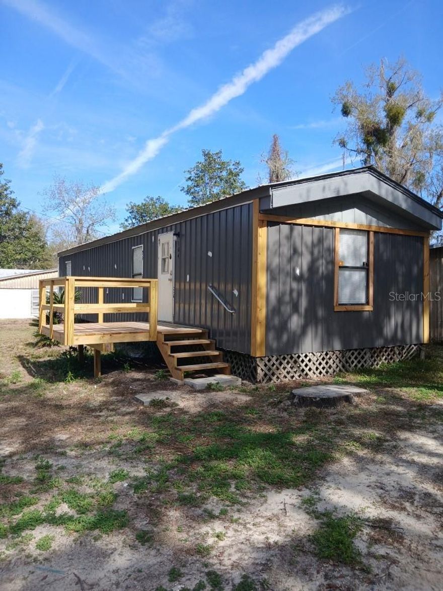 AVAILABLE APRIL 1ST  This cozy 2-bedroom, 1-bath mobile home offers 672 square feet of comfortable living space with several recent updates. The home features an updated kitchen with modern finishes and durable LVP flooring throughout, providing both style and easy maintenance. Enjoy relaxing outdoors on the private deck, perfect for morning coffee or unwinding in the evening. The property also includes a small workshop/storage building for added convenience. It has deeded access to Lake Lak-A-Wanna and is a smoke-free and pet-free property, creating a clean and quiet living environment.