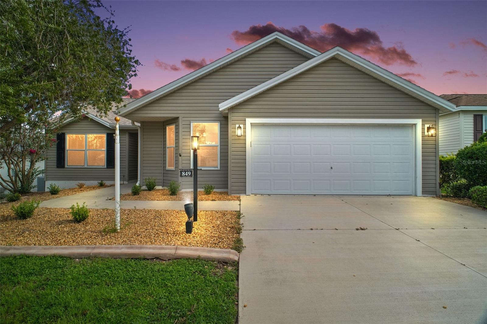 BEAUTIFULLY RENOVATED 3/2 WISTERIA MODEL with NEW ROOF (2025) and NEW HVAC (2024) in the highly desirable VILLAGE OF LARGO! This impressive home with a 2-car garage has been thoughtfully updated from top to bottom, blending modern style, high-quality finishes, and an unbeatable central location. From the moment you arrive, the freshly landscaped yard with decorative curbing sets the tone for the charm and sophistication you’ll find inside. Step into an open-concept floor plan designed for easy living and entertaining. The spacious living and dining areas are highlighted by new luxury vinyl plank flooring, elegant light fixtures, and sliding doors that lead to a large screened lanai and rear patio—the perfect setting for gatherings or peaceful evenings outdoors. The redesigned kitchen is a true centerpiece, featuring gleaming granite countertops, refinished white cabinetry with bold black pulls, brand-new appliances, and a bright bay-window dinette. It’s a beautiful and functional space that makes both cooking and hosting a joy. The primary suite is a relaxing retreat with luxury vinyl plank flooring, a redesigned master closet, and a spa-inspired en-suite bath offering double sinks, granite counters, white cabinetry, and a walk-in shower. Two additional bedrooms with built-in closets share a stunningly refreshed second bathroom with updated finishes and granite countertops. No detail has been overlooked—fresh interior paint on walls, trim, and concrete floors; new window blinds and door hardware; a WiFi-enabled garage door opener; five new LED fixtures in the garage; updated smoke detectors; all-new plumbing fixtures (including toilets); new ceiling fans and light fixtures throughout; and replaced electrical outlets and switches. Every upgrade provides convenience, comfort, and peace of mind. Enjoy the Florida lifestyle outdoors with a spacious screened lanai and rear patio, perfect for relaxing in the sunshine or entertaining friends. Ideally located in the Village of Largo, this home is just minutes from Lake Sumter Landing and Brownwood Paddock Square, plus you’ll be close to Havana and Mallory Hill Championship Golf & Country Clubs, Bacall, Canal Street, and Colony Cottage Recreation Centers, multiple pools including Hadley, Amelia, and Largo, as well as pickleball, dining, shopping, medical, and more along CR 466A. This move-in ready Wisteria Model combines luxury, convenience, and location all in one. Don’t wait—schedule your private showing or virtual tour today and experience The Villages lifestyle at its finest!