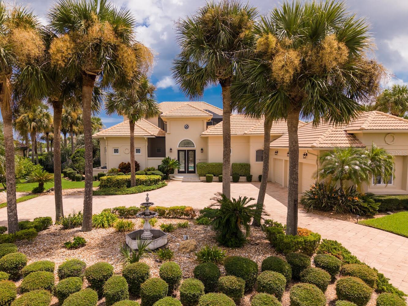EXCEPTIONALLY PRICED!!! What an Opportunity to Live on San Gabriel Lane in Hammock Dunes! An Entertainers Delight and a Homebody's Dream! A Grand Open Concept Space, Breathtakingly Light and Airy while Spacious and Serene! Gorgeous Courtyard Pool Entrance! A Private Entry One Bedroom One Bath Casita perfect for Guests. Chef's Kitchen features 2 full size built in ovens, eat in area, and an extra large walk in wet bar with wine fridge. French doors in the Living Room, Dining Room and Family Room all lead to a Sun filled screened in Lanai overlooking the Lake. Luxurious Primary Bedroom and Opulent Bath located on the First floor. Upstairs you will find an Office, an Ensuite Bedroom and bath with Jacuzzi tub. A 4th Bedroom currently used as a Gym with a bath access and Private Balcony overlooking the Courtyard Pool. Step out on the upstairs Balcony for morning coffee or afternoon cocktails and feel the Ocean Breeze. Gaze over the Lake to endless Ocean Views. 3 car Garage with built in cabinet storage and extra fridge. Just under a half acre of mature landscaped grounds with a circular driveway and a fully fence back yard. Outside of Home painted in 2024, New Hot Water Heater in 2023 and 3 new Air Conditioning Systems in 2025. Membership to The Hammock Dunes Club is available but not required. The "World Class" Hammock Dunes Club features an Oceanfront Clubhouse, Dining, Fitness Center, Heated Pool and Spa, Tennis Center, Two Championship Golf Courses and much, much more. Don't miss this Rare Opportunity to own this Beautiful Home and schedule your Private Showing today!