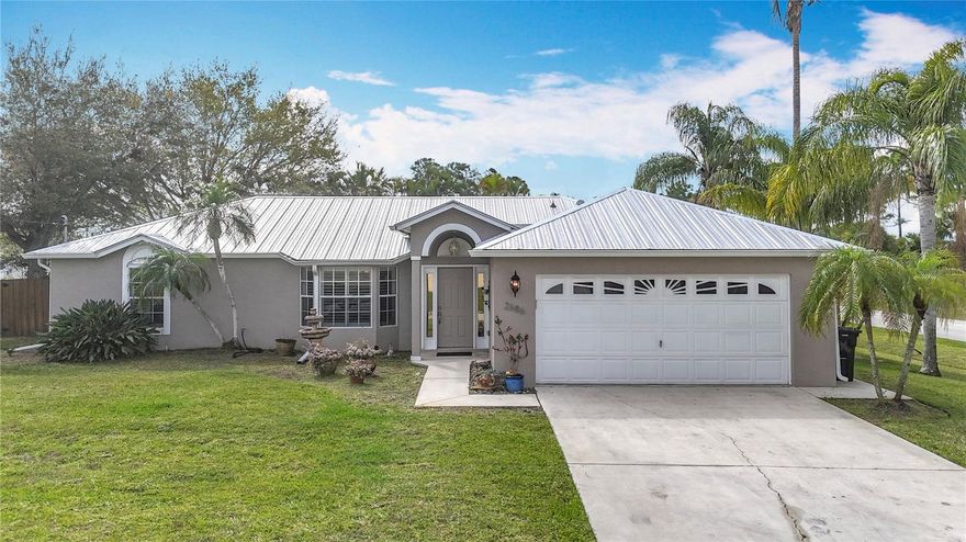 Welcome to your beautifully updated home in the heart of Port St. Lucie—just 15 miles from the sandy shores of Jensen Beach! This move-in-ready gem perfectly blends charm, modern style, and long-lasting durability.

Step inside to find a seamless combination of tile, engineered hardwood, and laminate flooring, complemented by elegant upgrades including 6-inch baseboards, crown molding throughout, and classic plantation shutters that add both sophistication and warmth.

The kitchen and bathrooms are tastefully updated with granite countertops, offering both beauty and functionality for everyday living and entertaining.

One of the standout features of this home is the expansive 13’ x 36’ air-conditioned and heated bonus room just off the kitchen—an incredibly versatile space ideal for a family room, home office, media room, or even a private retreat.

Outside, enjoy a spacious, fully fenced backyard with plenty of room to relax, entertain, or store your toys, complete with a large 12’ x 16’ storage shed for added convenience.

Situated on a desirable corner lot, this home also features a durable metal roof and custom hurricane shutters, giving you peace of mind and long-term value.

This is Florida living at its best—style, space, and location all in one. Don’t miss your opportunity to make it yours! Schedule your private showing today.