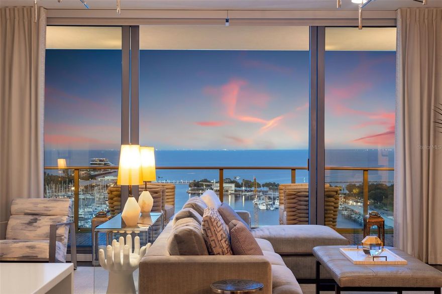Welcome to this stunning water-view FURNISHED center residence at the prestigious ONE St. Petersburg tower. This unit, boasting the most desirable floor plan in the building, redefines luxury living with its sleek design and awe-inspiring views. Along with over $100k in upgrades, this residence epitomizes sophistication and elegance.

With two bedrooms, three full bathrooms, and a versatile den, this condo exudes spaciousness and style. Adorned with chic hardwood floors, bespoke wall coverings, and curated lighting fixtures,  it comes as no surprise that this stand-out condo was recently a finalist in HGTV’s ULTIMATE HOUSE HUNT in 2023.

As you gaze beyond the floor-to-ceiling sliding doors, a sprawling 369 square foot balcony awaits, offering panoramic views of Tampa Bay's vibrant downtown waterfront. From the tranquil waters to the bustling marina, the annual Grand Prix spectacle, and daily sunrises that are truly stunning, every moment is a breathtaking experience.

Entertain with ease in the deluxe gourmet kitchen, equipped with JennAir stainless steel appliances, imported European cabinetry, chic backsplash, center island with bar seating and sleek quartz countertops. Just off the kitchen discover a thoughtfully designed and spacious den, perfect for a functional office space, or it could easily serve as guest quarters as it has it’s own en-suite bath.

Retreat to the sumptuous primary owner's suite and second bedroom, each boasting spa-inspired bathrooms, walk-in closets, and captivating views.

Convenience meets luxury with two side-by-side parking spaces and a climate-controlled storage unit, all seamlessly integrated within the building's secure garage.

Residents of ONE St. Petersburg indulge in a lifestyle of opulence with access to world-class amenities, including a state-of-the-art fitness center, meeting suites, social room, library, game room, and a 75' heated lap pool surrounded by private cabanas, an outdoor kitchen complete with four grills and two fire pits and a rejuvenating spa.

Situated in the heart of downtown St. Pete, this premier location offers unparalleled walkability to a myriad of dining, shopping, and entertainment options. From cultural landmarks to waterfront parks and bustling markets, every adventure awaits just steps from your doorstep.