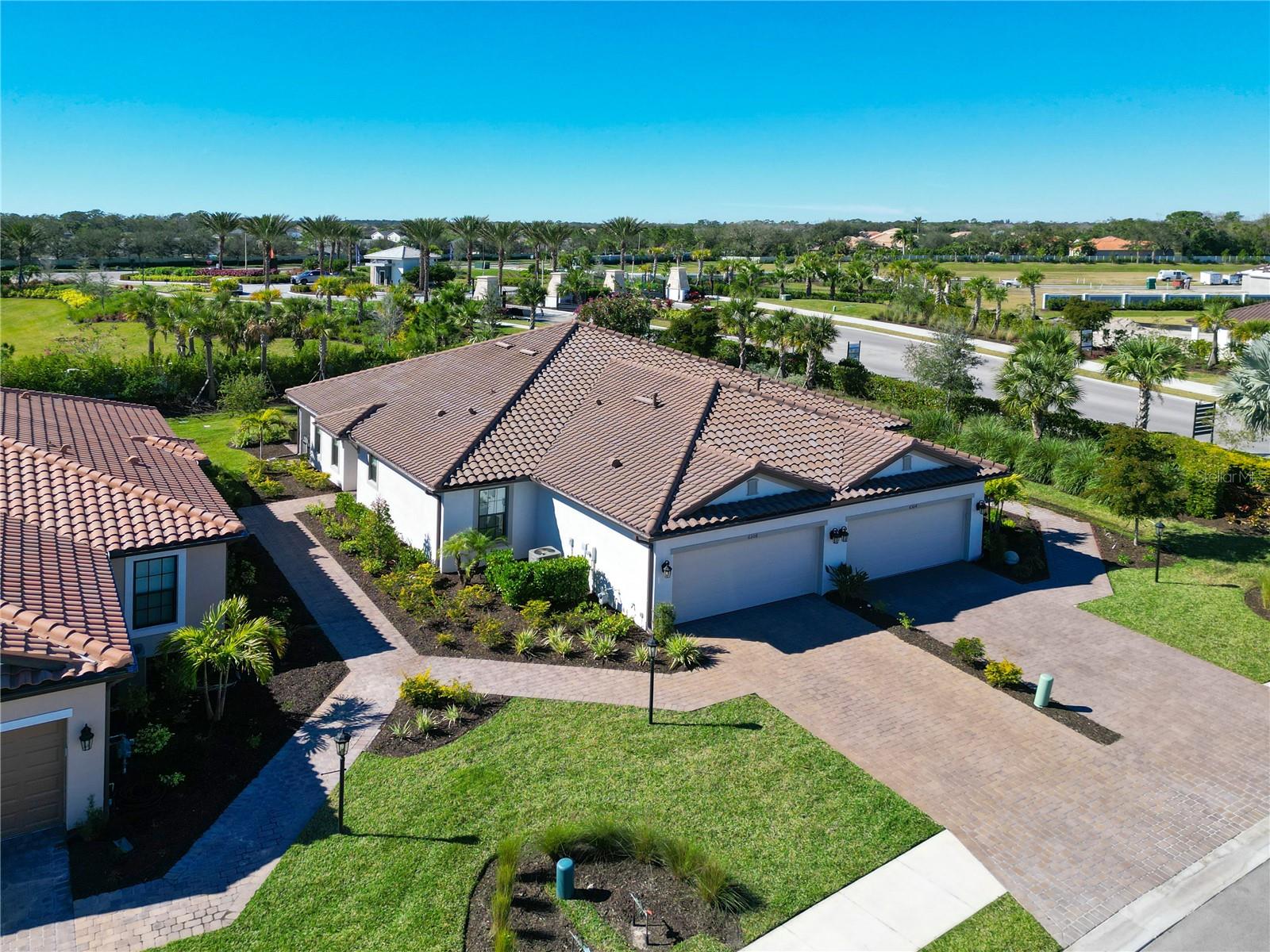 UNBELIEVABLE $41,000 PRICE REDUCTION - No waiting, just move in! This beautifully upgraded twin villa, located in the highly sought-after Esplanade at The Heights gated community, offers an unbeatable location just minutes from University Town Mall, top dining and shopping in Sarasota. Nestled on a peaceful cul-de-sac, this villa comes partially furnished and is ready for you to call home.
Step through the beveled glass front door and into a bright and airy living area with floor-to-ceiling custom Calico Corners draperies. Torsion fans in brushed nickel and wood circulate the gentle breeze under elegant tray ceilings, enhancing the serene atmosphere created by the swaying palms visible from every window. The kitchen is a chef's dream with crisp white cabinetry finished with crown molding, a sleek white subway tile backsplash, and Silestone quartz countertops. A Bosch three-door refrigerator and GE appliances complete the contemporary look, while soft lighting from pendant fixtures and under-cabinet lights creates a warm ambiance at dusk.
The villa boasts two en-suite bedrooms, perfectly separated for privacy. The Master Suite offers stunning southwestern views, perfect for watching sunsets and stargazing, while the Guest Suite captures the beauty of sunrise. A private office or study with pocket doors adds flexibility to the floor plan.
The custom laundry room is both functional and stylish, featuring a commercial-grade Maytag washer and dryer, a Quartz folding counter, a deep stainless steel sink, and cabinetry that mirrors the kitchen's design. The home continues to impress with a two-car garage, complete with a low-maintenance gray epoxy floor.
Esplanade at The Heights offers exceptional amenities, including a full-time concierge, resort-style pool and spa, tennis and pickleball courts, bocce ball, a fire pit, and an elevated, landscaped exercise hill perfect for hiking, running, or walking. Located just minutes from UTC, Sarasota Airport, and downtown Sarasota, this villa is truly in the heart of it all.
With over $62K in upgrades, why wait to build? Move into this immaculate, move-in-ready villa today and start enjoying the best of Sarasota living.