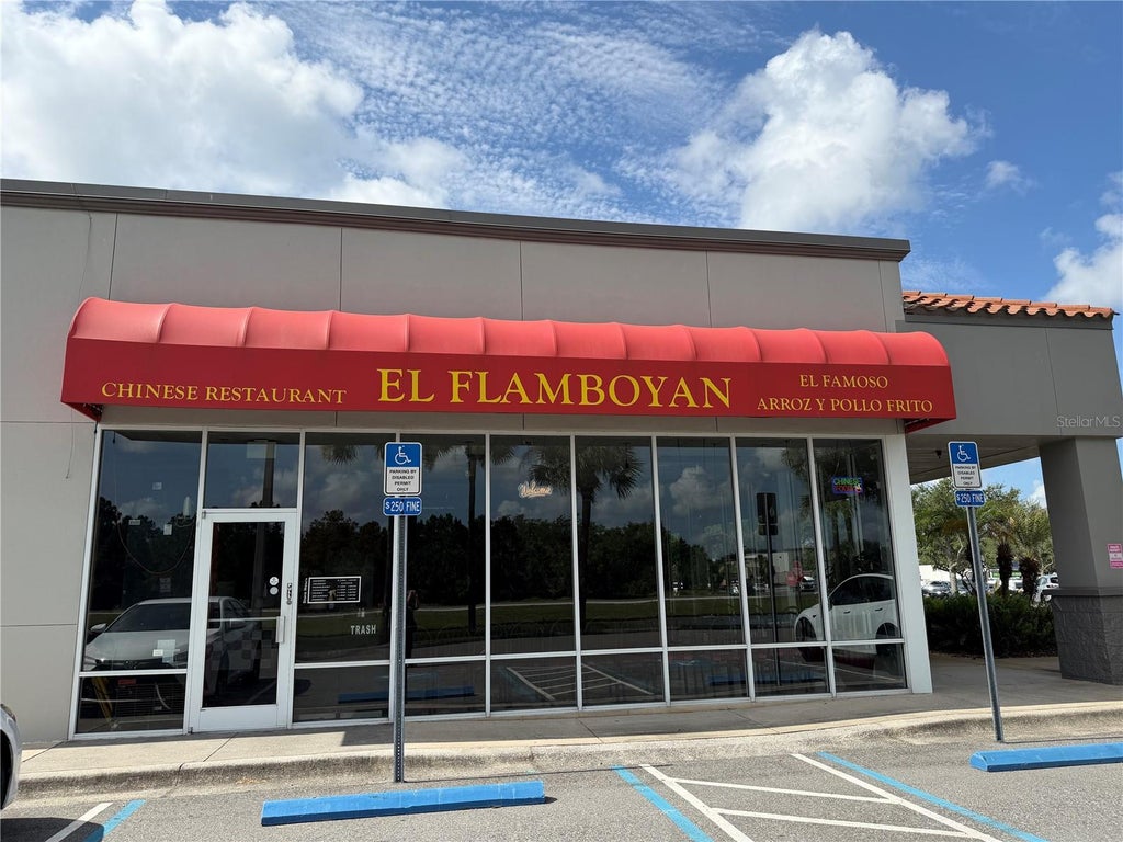 Photo of 12141 S Orange Blossom Trail, Orlando, FL 32837 (MLS # O6429038)