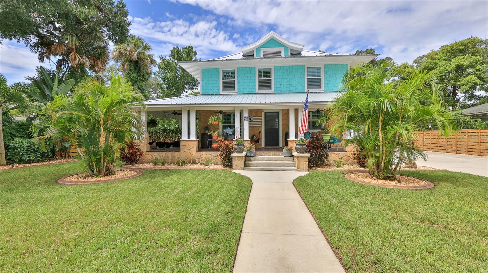 Stunning , Historic “1915” Estate Home nestled in the heart of New Smyrna Beach. Only steps to legendary “Canal Street’s shops/ restaurants and Riverfront park”. Sits on ½ acre of lush, manicured property. This unique one of a kind ”Refurbished Time Piece Home” has recently undergone major restorations which include: additional theater /entertainment room 2024, new metal roof 2022, windows, doors, new kitchen with high end appliances and a gas tankless water heater, complete electrical upgrade, complete plumbing upgrade, foam insulation , central heat and air plus a Butler’s pantry off the kitchen. Owner’s pride in the true craftsmanship with attention to the fine detail including: Old Chicago brick floors/ walls, original heart pine floors restored, Original Doors and hardware restored back to their beautiful natural wood, wood ceiling highlights the custom crown moldings, new trim and Coastal plantation shutters thru out. The home has exceptional custom detail not seen in most homes such as a wine cellar, exposed old Chicago brick fireplace (gas) entertainment room has bar with retro fridge and undercounter ice maker, set to entertain your friends. All Mounted smart TV’s included Covered brick lanai for cooking out and enjoying your private backyard. The large lot offers room for your toys, has a RV hook-up, 30’ wide driveway, open wrap around porch, The bike ride to the beach, Flagler Ave., restaurants and parks will take you about 15 minutes This beautiful home has character unmatched Please bring your pickiest buyers they will appreciate the detail and character this home offers. Garage is ASIS. Broker Owned