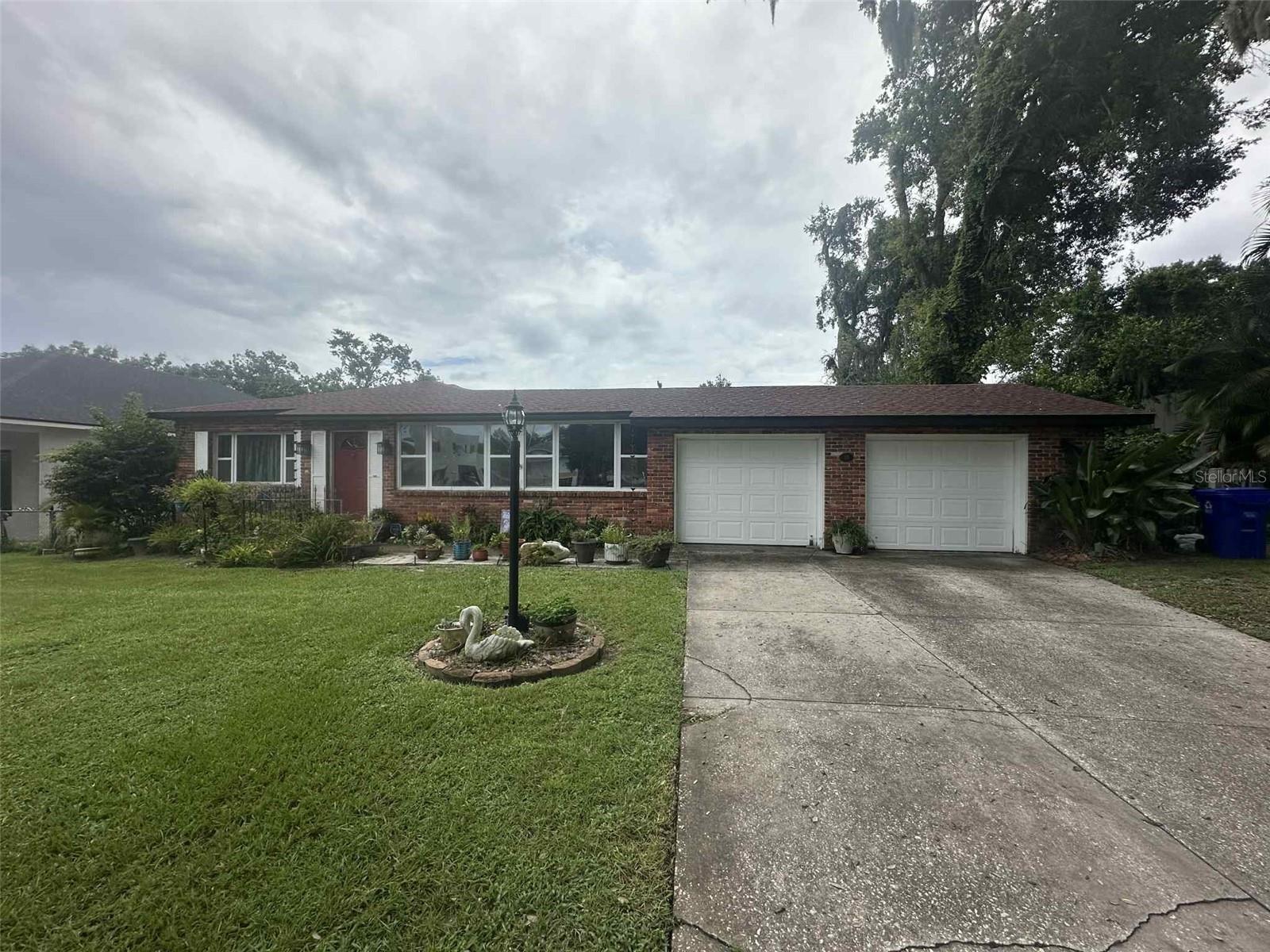 Located in the city's most desirable area just minutes from Lake Hollingsworth and Cleveland Heights Golf Course. This 3 bedroom, 2 bath home offers plenty of charm and living space. The enclosed front porch can easily serve as a cozy living room and formal dining area. The family room provides even more space. The master bath has been updated to a modern walk-in shower. Please note, the second bedroom is required to walk thru to the primary suite. This would make for a perfect office or nursery. Outdoor living is easy with a screened lanai and a fully fenced backyard, perfect for relaxing and entertaining. This is a rare find!