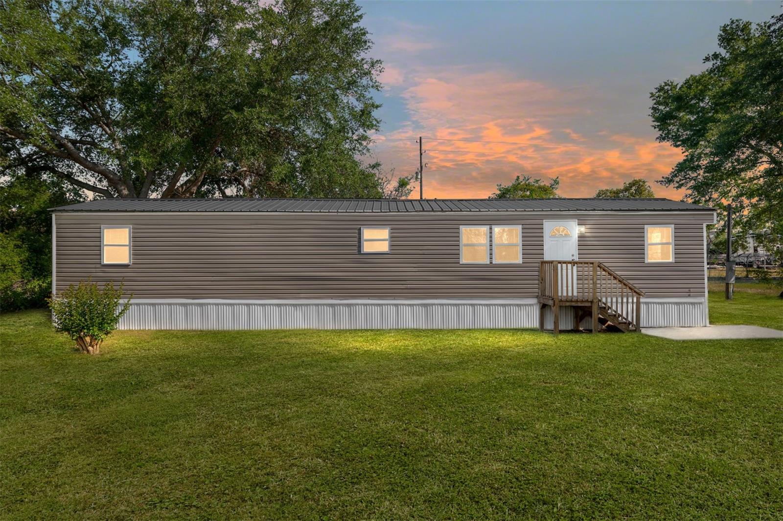 Welcome to Little Lake Weir in Summerfield, FL. This 2-bedroom, 1-bathroom home offers 784 square feet of living space on a fenced 0.29-acre lot, which backs up to the Spruce Creek RV Storage facility so you have no neighbors directly behind you.
Recent updates include a new air conditioner, new siding, new skirting, new exterior doors, new windows, new steps, and a new well house shed. The interior has been freshly painted, and a washer is included and located inside the home for added convenience.
The property is located just off Highway 441, providing easy access to local shopping, dining, and recreational opportunities. Lake Weir is just minutes away.
This is a well-maintained home at an attractive price—schedule your showing today