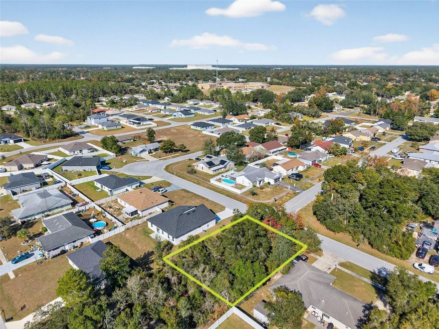 Located in one of Ocala’s most active residential growth areas, this 0.18-acre R-1 zoned lot offers a standout advantage rarely found in Marion Oaks: access to power, county water, AND county sewer at the street.

The property is situated at 15050 SW 38th Cir, Ocala, FL 34473 (address for locational purposes only and not a legal situs) and lies within Flood Zone X, making it well-suited for residential construction without the added complications or insurance concerns associated with flood-prone parcels.

For builders, this lot presents a streamlined development opportunity. Public water and sewer availability - confirmed by a Marion County utility availability letter - can significantly reduce upfront infrastructure costs compared to well and septic installations, while also appealing to today’s buyers who increasingly prefer public utilities.

The lot is wooded and uncleared, allowing flexibility for site planning and home orientation, and is located on a paved residential street in an area with ongoing development and strong buyer demand.

Some location highlights include approximately 5 minutes to Horizon Academy, quick access to CR 484, and only 10 minutes to I-75, providing convenient connectivity to Ocala, The Villages, and surrounding areas.

With no HOA and traditional R-1 zoning, this parcel is well positioned for a primary residence, spec home, or long-term investment in a steadily growing corridor of Marion County.

Buildable lots with public water and sewer access are becoming increasingly scarce in Marion Oaks, making this property a compelling option for buyers seeking efficiency, flexibility, and long-term value. Agent has ownership interest in the property, and buyer should verify all details.