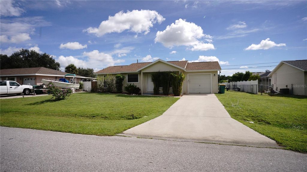 Photo of 304 Fletcher Street, Port Charlotte, FL 33954 (MLS # O6348180)