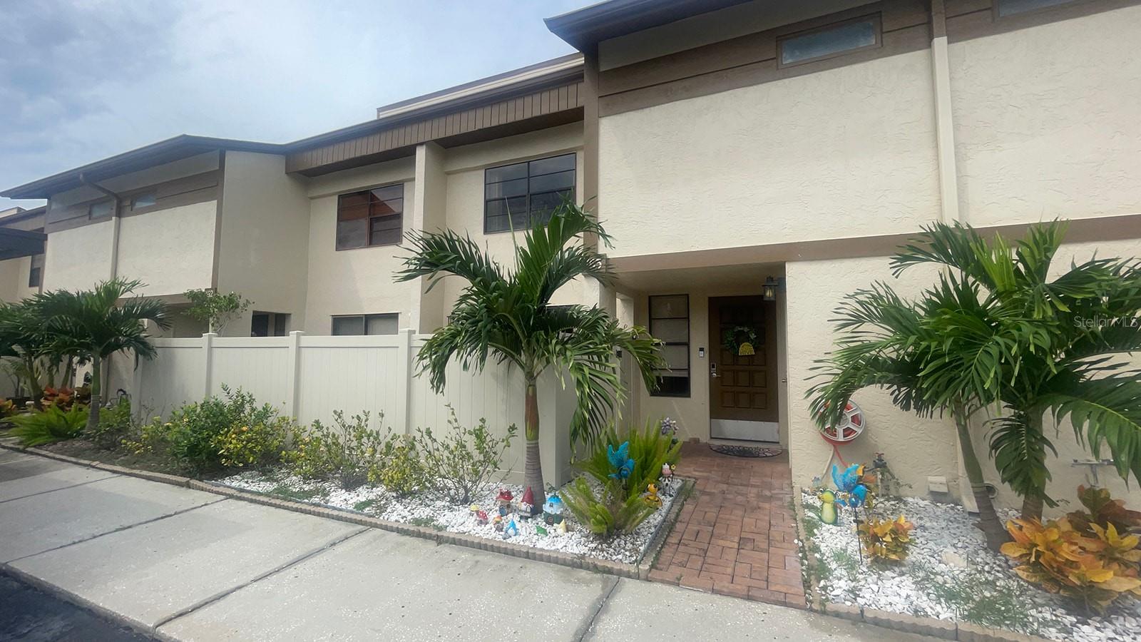 Welcome to the Townhomes of Lake Seminole, where that easygoing lake life blends seamlessly with all the modern comforts you could ask for. We're talking a move-in ready spot in a well-kept, quiet complex right on Lake Seminole itself. It's a pet-friendly, all-ages community that honestly feels like your own private resort: picture a sparkling pool, tennis and pickleball courts, a clubhouse with billiards for those lazy afternoons, and—get this—a private dock and fishing pier just steps from your door. Paddleboarding, kayaking, or taking those peaceful evening strolls along the water? That's the everyday vibe here. And the perks don't stop there—the monthly fee covers everything from high-speed internet and cable to water, sewer, trash pickup, exterior maintenance, roof repairs, lawn care, pest control, and even both flood and master insurance. Talk about real value; it leaves you free to just enjoy. Now, let me walk you through this charming 3-bedroom, 2.5-bathroom townhome—it's a two-story beauty that's all about blending cozy comfort with smart convenience, wrapped in the serenity of nature. Step inside, and you're greeted by an updated kitchen that's a dream for any home cook: gleaming granite countertops, sleek wood cabinetry, and a full suite of stainless steel appliances ready to inspire. That marble backsplash? It adds just the right touch of elegance, turning every meal prep into something special. Right off it, you've got a spacious walk-in laundry and pantry room, complete with a high-efficiency front-load washer and dryer to make those daily chores a breeze. Down on the welcoming first floor, the living and dining areas flow together beautifully, and here's the kicker—two sliding doors that open up to dual patios: one open and sunny out front for those morning coffees in the light, and a screened one in the back for your private evening escapes, maybe with a cool drink and the sound of the lake nearby. Head upstairs to the second floor, and it's all about that personal retreat. The primary bedroom is your restful haven, with a generous walk-in closet, an extra closet for all your storage needs, and an en-suite bath featuring a large vanity plus a separate shower and tub setup for ultimate relaxation. Rounding it out, two additional bedrooms and a full bath give you plenty of flexibility—whether for guests, roommates, a home office, or whatever suits your life. Oh, and as a sweet bonus, you'll score free access to the gym at the nearby Seminole Recreation Center, keeping your fitness game strong without the hassle. Location-wise? It's spot-on. We're close to top-rated schools, just 1.5 miles from Seminole City Center for all your shopping, dining, and movie nights; 1.7 miles to St. Petersburg College and the library; 5 miles to Indian Shores Beach; 6 miles to Indian Rocks Beach; 12 miles to Clearwater Beach; 13 miles to downtown St. Pete; and a quick 22 miles to Tampa International Airport. Convenience doesn't get much better. So, ready to make this your spot? Let's get that showing on the calendar—your new home is waiting!