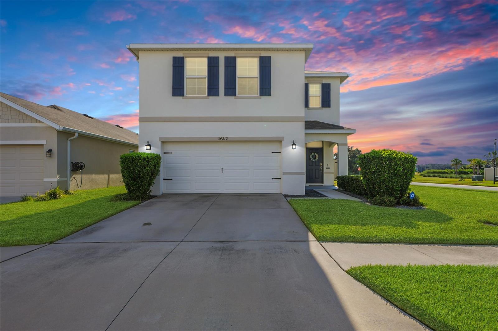 Welcome to 34212 Jasper Stone Dr – A Like-New Showpiece in the Heart of Wesley Chapel! This stunning 4-bedroom, 2.5-bath home is perfectly situated on a desirable corner lot in a vibrant, amenity-rich community. From the moment you step inside, you’ll love the light and bright open layout, highlighted by fresh interior paint, sleek granite countertops, stainless steel appliances, walk in pantry, and a spacious great room ideal for entertaining. Upstairs, all four bedrooms provide privacy and comfort, including an oversized primary suite with a huge walk-in closet and a spa-like en suite bathroom. You’ll also appreciate the convenient upstairs laundry and closets galore for all your storage needs. Step outside to relax or entertain on the extended patio overlooking a large fenced backyard—perfect for pets, play, or weekend barbecues. Additional features include epoxy flooring in the garage, a water softener system, and a location that can’t be beat. Enjoy community amenities such as a pool, playground, and sports courts, all just minutes from Wiregrass Mall, schools, dining, and all the best of Wesley Chapel. Don’t miss your chance to own this move-in ready beauty—schedule your private showing today! **Ask us about our Preferred Lender Incentive available where you could save thousands $$$**