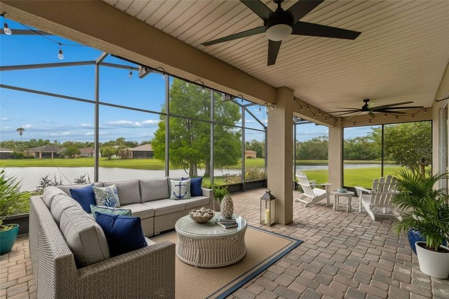 One or more photo(s) has been virtually staged. Experience an unparalleled lifestyle in this stunning waterfront home, where breathtaking views and thoughtfully designed living spaces come together seamlessly. This exquisite property features 3 spacious bedrooms, 3 modern bathrooms, and a versatile den/study, making it ideal for both everyday living and entertaining. As you arrive, you’re welcomed by an elegant screened courtyard with custom double leaded glass entry doors, setting a sophisticated tone from the very beginning. Inside, the home showcases a seamless blend of style and comfort with ceramic tile and luxury vinyl plank flooring throughout the main living areas. The expansive great room is a true centerpiece, offering panoramic water views and abundant natural light that create a warm, inviting atmosphere. The gourmet kitchen is a chef’s dream, featuring Beautiful tile backsplash, Stainless steel appliances, Spacious eat-at bar, Ample cabinetry and counter space and Upgraded lighting. Adjacent to the kitchen, the dining area continues the experience with picturesque waterfront views, making every meal feel extraordinary. The primary suite is a private retreat, complete with a cozy sitting area, two large walk-in closets, and a luxurious en-suite bath featuring a custom walk-in shower. For added flexibility and privacy, the home includes a separate casita/in-law suite located across the courtyard—perfect for guests or extended family or a craft room. Step outside to your covered and extended screened lanai, where you can relax, entertain, and enjoy serene water views and stunning sunsets year-round. Additional highlights include 2-car garage with ample storage, Extra-large laundry room with utility sink, New roof (2023), New HVAC for casita (2023), Main HVAC updated (2017),and a water softener system. This exceptional waterfront property offers the perfect blend of luxury, comfort, and functionality—your private oasis awaits. Solivita is a premier 55+ community, offering residents an exceptional lifestyle with state-of-the-art amenities. Enjoy  2  fully equipped fitness centers, dance and aerobics studios, and an impressive array of recreational options including 14 heated swimming pools, two heated spas, tennis courts, pickleball courts, shuffleboard, bocce ball, billiards, and an art gallery. The community also features three on-site restaurants and two championship 18-hole golf courses. With a full calendar of activities and events, there’s always something new to explore and enjoy. This home is conveniently located near a hospital and medical office complex, and shopping center.