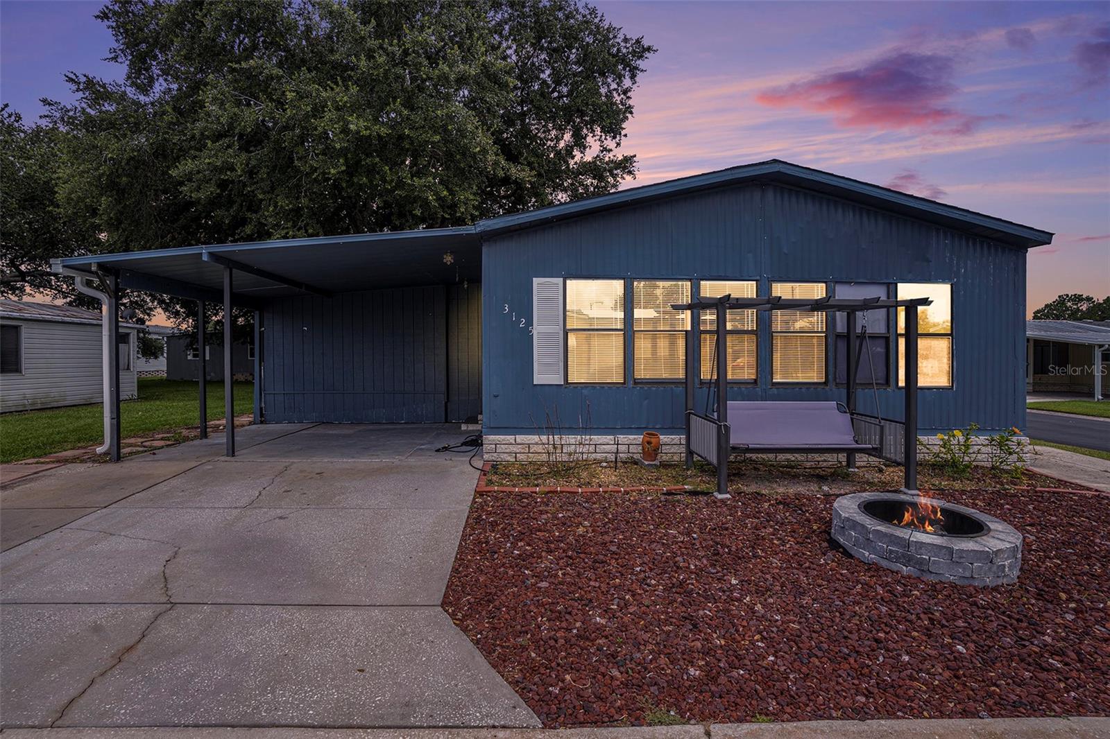 Welcome to this beautifully updated 3-bedroom, 2-bathroom manufactured home located in a welcoming and amenity-rich community in Zephyrhills, Florida! This move-in-ready home features a 3-year old roof, fresh interior paint and a newly renovated kitchen with brand-new stainless-steel appliances- perfect for modern living and entertaining. Natural light flows throughout the space, enhanced by newer skylights. The spacious primary bedroom includes an en-suite bathroom, offering privacy and comfort. Step out onto the sundeck, fully redone in 2017, and enjoy your outdoor space year-round. Additional highlights include a large, fully enclosed attached storage room with washer and dryer hook-ups, ideal for laundry, hobbies, or extra storage. Enjoy a low monthly HOA fee and NO lot lease- a rare find! The community offers fantastic amenities such as a swimming pool, clubhouse, shuffleboard courts, and regular events like Bingo night. Plus, a 24/7 security guard provides added peace of mind. Don't miss your chance to own this updated, affordable home in a great location. Schedule your private showing today!