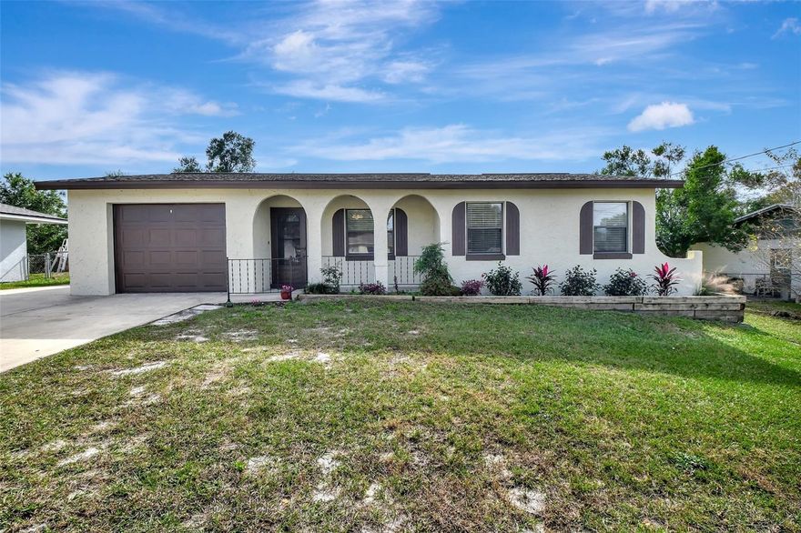 Discover the perfect home and location  in Orange City! This super cute 4-bedroom, 2-bathroom home boasts a refreshing pool and has undergone recent renovations, making it move-in ready. Enjoy a generous living space and a kitchen equipped with stainless-steel appliances. The primary suite showcases an updated bathroom with a beautifully tiled shower, complemented by a spacious walk-in closet.  LUXURY VINYL PLANK FLOORING IN ALL BEDROOMS.   FRESHLY PAINTED INTERIOR AND EXTERIOR.  NEW SOFFITS.  UPDATED ELECTRIC PANEL BOX. ROOF REPLACED IN 2017.  HURRICANE SHUTTERS. FENCED YARD.  NEW INTERIOR DOORS.  1 CAR GARAGE AND EXTRA PARKING PAD.  18x18 COVERED AND SCREENED PORCH.  INGROUND POOL WITH LARGE DECK.  EXCELLENT LOCATION~ This residence is conveniently situated mere minutes away from I-4  for  an easy commute to Lake Mary, Orlando, Daytona, and the beaches. Enjoy proximity to shopping, restaurants, Blue Springs State Park, Schools,  Medical Center, Starbucks, and the DeBary Sunrail train station.  Simply move in and unpack your bags!