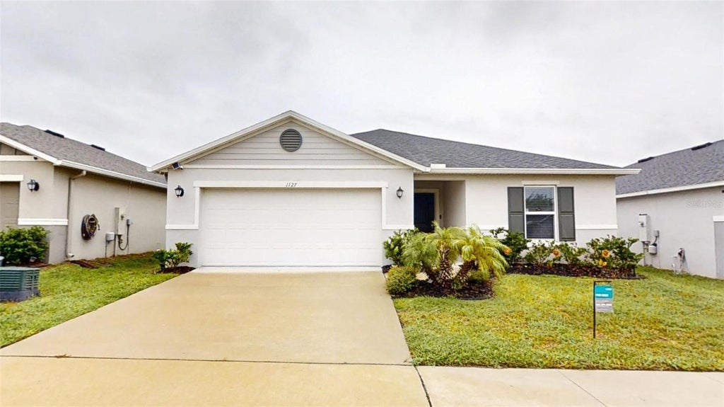 Photo of 1127 Seedorf Drive, Winter Haven, FL 33881 (MLS # O6448944)