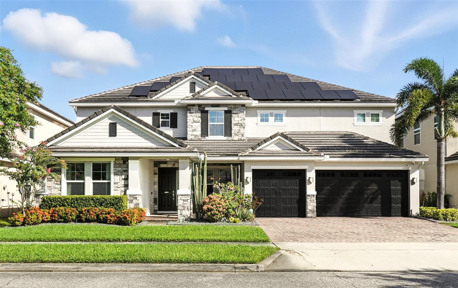 Introducing a rare opportunity to own a truly remarkable lakefront estate in the heart of Windermere's prestigious Lake Burden South community. This 5,102 sq ft modern contemporary masterpiece offers 5 spacious bedrooms, including two luxurious primary suites—one upstairs and one down—plus a dedicated office, versatile flex room, and massive bonus/media room, 5 full bathrooms, 2 half baths, and a 3-car garage, every inch of this home is designed for comfort, function, and elegance.
Step inside to soaring 22-foot ceilings, abundant natural light, and open spaces ideal for both quiet evenings and lively gatherings. The stunning great room is centered around a dramatic custom built-in with electric fireplace, flowing effortlessly into the chef’s kitchen featuring a large island, double ovens, French-door refrigerator, wine fridge, and stainless steel appliances—perfect for hosting grand meals or casual breakfasts. Luxury vinyl plank flooring, French doors, and all-new lever-style hardware add a touch of timeless sophistication throughout.
Step outside and discover your private backyard oasis—a fully fenced yard with an extended covered lanai with remote-controlled retractable screens, overlooking a custom saltwater, solar-heated pool and spa. Upgrades include a 2022 Solar Source pool heater, 2024 Pentair spa heater, Wi-Fi enabled smart lighting, and a new Jandy pool pump—all recent enhancements. The upstairs master suite and bonus room both feature private balconies offering panoramic views of Lake Burden, while the polyaspartic garage floor, ADT security with perimeter cameras, Ring doorbell (2024), and Wi-Fi-enabled smart home features round out this impressive package.
Enjoy the Florida lifestyle with community walking trails, tennis courts, ballfields, fishing dock, and the unique bridge connection to Sunset Park Elementary. This quiet cul-de-sac location is minutes from upscale shopping, dining, and just 5 miles to Disney, all while being zoned for top-rated schools including Windermere High.
With no rear neighbors, no carpet, and a wealth of thoughtful upgrades, this move-in-ready showplace is the ideal blend of luxury, comfort, and lakefront tranquility. Schedule your private showing today—this is the home you've been waiting for
