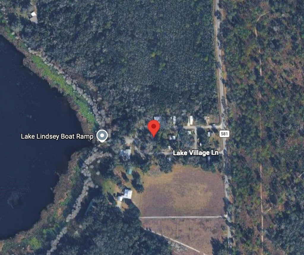 Photo of 22404 Lake Village Lane, Brooksville, FL 34601 (MLS # TB8558829)