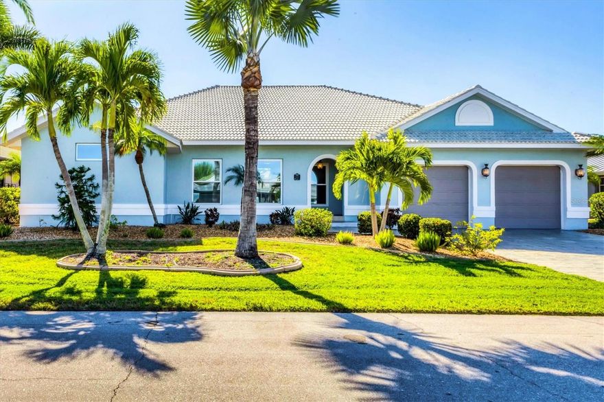 One or more photo(s) has been virtually staged. Live the Florida waterfront lifestyle you’ve been dreaming of in this beautifully updated 2,777 sq. ft. Punta Gorda Isles home—perfectly designed for boating, entertaining, and everyday enjoyment. Located just minutes from open waters leading to Charlotte Harbor and the Gulf, this 3-bedroom, 2.5-bath residence offers peace of mind with major upgrades including a new HVAC (2025), pool heater and pump (2025), gas tankless water heater, extended 55-foot dock (2023), 10,000 lb boat lift, and newer appliances including refrigerator (2024), dishwasher (2024), and induction range (2025). Fresh interior paint completes the move-in-ready appeal.

Inside, soaring ceilings, Turkish travertine floors, and elegant architectural details create a bright, open feel throughout. The eat-in chef’s kitchen flows seamlessly into the great room, creating an ideal space for gathering and entertaining, all with beautiful pool and canal views. A private office with custom built-in shelving overlooks the canal and lanai, offering a peaceful and inspiring work-from-home retreat.

The spacious primary suite is a true sanctuary, featuring ample closet space, and a spa-like primary bath with double sinks, updated finishes, a walk-in shower, and a relaxing jetted tub.

Step outside to your personal resort-style escape with a 30-foot heated pool and spa, expansive pavered lanai, and a standout circular wet bar—perfect for hosting unforgettable gatherings or unwinding poolside at sunset. Enjoy the rare convenience of walking or biking to Fishermen’s Village, Gilchrist Park, downtown restaurants, waterfront parks, and scenic trails. This exceptional home offers the perfect blend of luxury, location, and the ultimate coastal boating lifestyle.