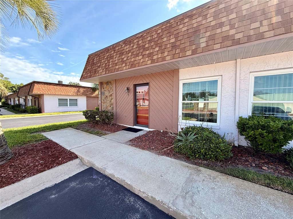 Photo of 6036 Chesham Drive #4, New Port Richey, FL 34653 (MLS # TB8535656)