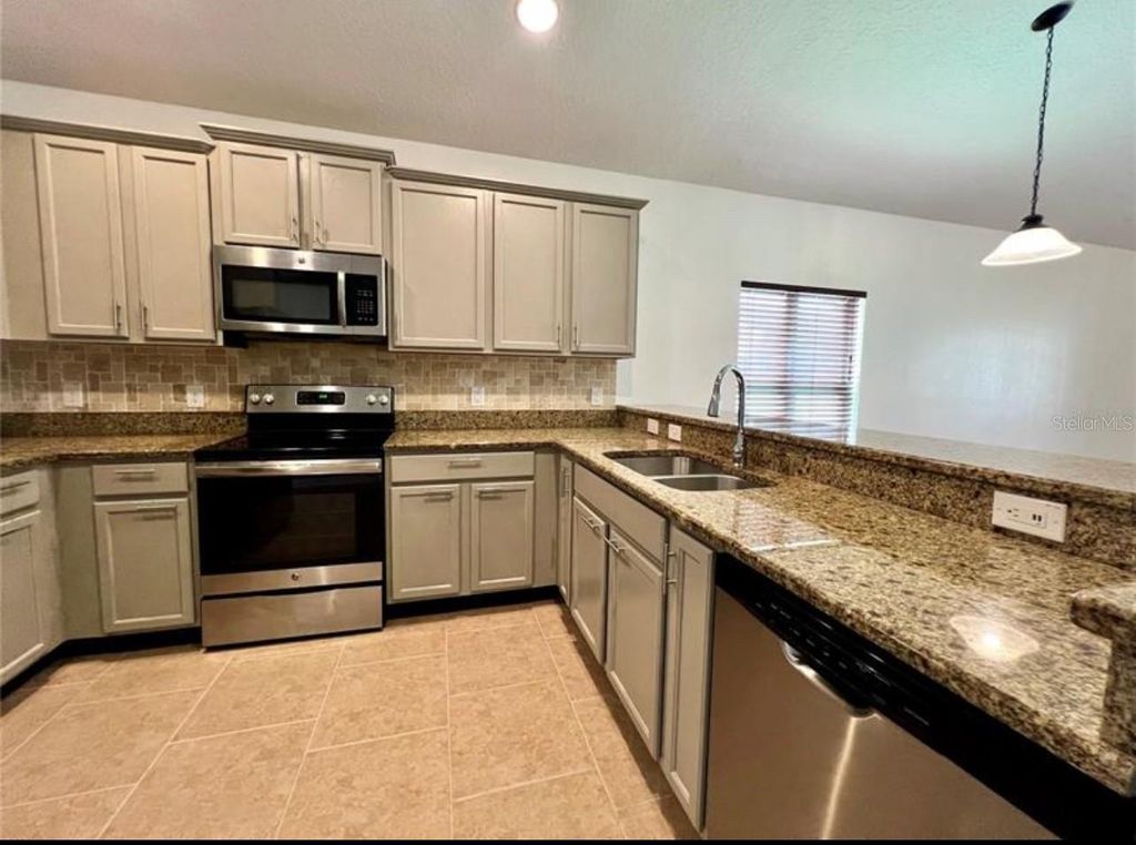 Photo of 959 Andalusia Loop, Davenport, FL 33837 (MLS # S5139406)