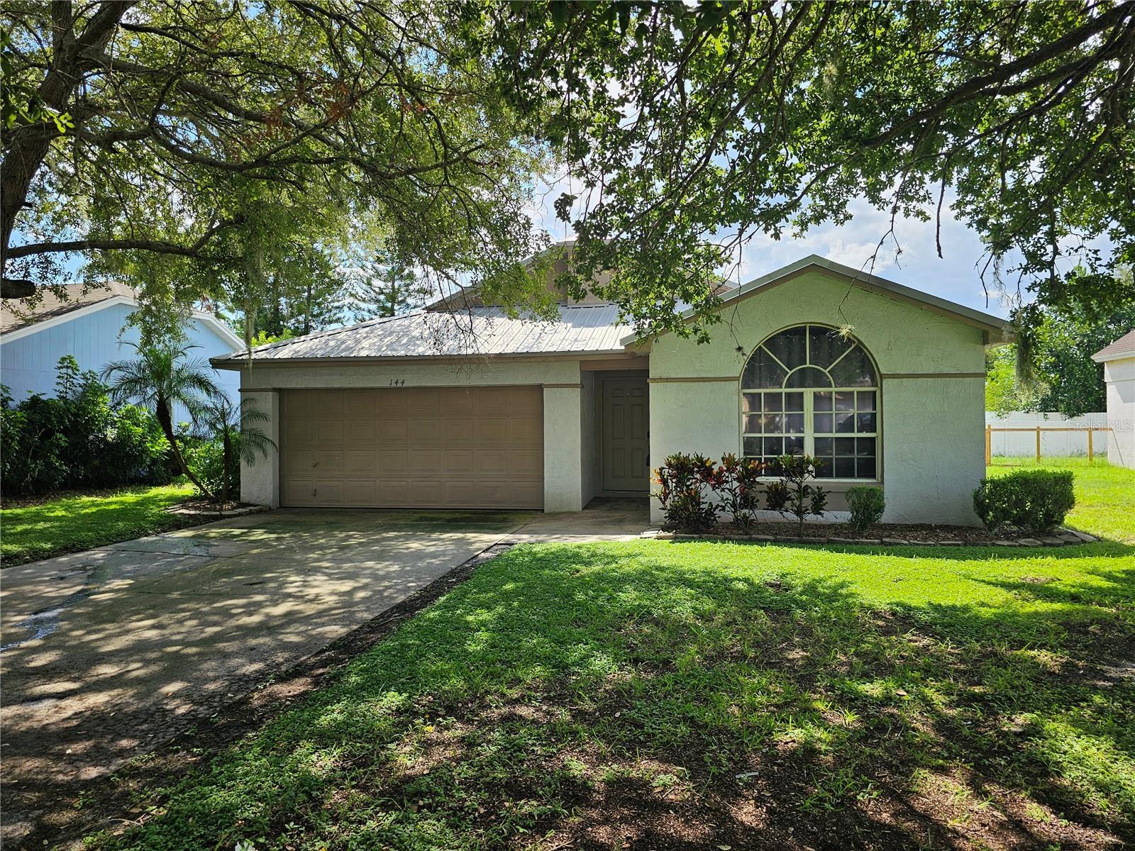 Short Sale. DELIGHTFUL 3 bedroom, 2 bath home with a 2-car garage! Spanning just over 1,300 square feet of living space, this home offers an OPEN FLOOR Plan with a nice-sized living room combined with the dining area and kitchen with an eat-in space. The kitchen boasts lovely countertops with a matching backsplash and ample cabinets for storage. Split Bedrooms! The primary bedroom is complete with its own bathroom, providing a large vanity with dual sinks and a walk-in shower. Tucked in REAR SCREENED lanai with tile flooring - perfect for relaxation or visiting family and/or friends! Minutes to shopping and dining. Don't miss this wonderful home, call us TODAY!