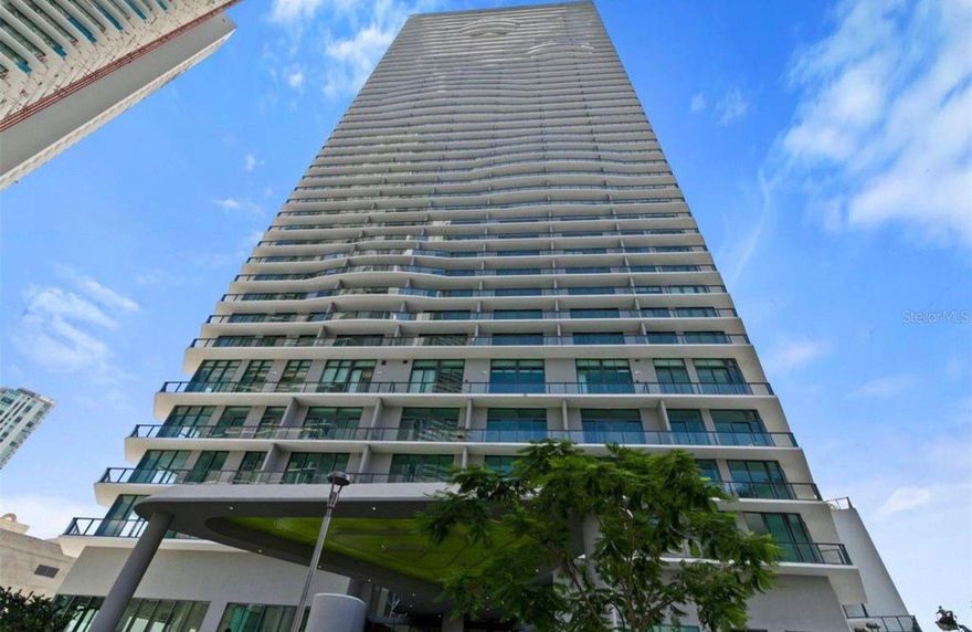 Stunning High-Floor Apartment in the Heart of Miami

Discover an incredible opportunity to own a beautiful apartment on the 18th floor of a prestigious 48-story building in Miami. This residence offers the perfect blend of comfort, style, and convenience, with breathtaking panoramic city and water views and an elevated lifestyle.

The apartment features two private balconies, providing spectacular views of the Miami skyline and the bay. Whether enjoying your morning coffee or relaxing at sunset, these spacious balconies offer the perfect setting to take in the stunning surroundings from every angle.

The residence includes 2 spacious bedrooms, including a primary suite with a walk-in closet, and 2 full bathrooms. The open floor plan seamlessly connects the living room and dining room, creating a bright and airy space ideal for both everyday living and entertaining. Floor-to-ceiling sliding glass doors enhance natural light and provide direct access to the balconies, maximizing the incredible views.

The kitchen is elegantly designed, showcasing solid wood cabinets, stone countertops, and all appliances included, combining functionality with modern appeal.

This unit also offers an additional enclosed den with a door, creating a private and versatile space that can be used as a home office, guest room, or bonus room.

Additional highlights include 1 assigned parking space and elevator access, ensuring comfort and practicality for daily life.

The condominium itself offers exceptional amenities, including a large resort-style swimming pool, playground, fully equipped gym, game room, clubhouse, and more—designed to enhance your lifestyle and provide enjoyment for all ages.

Ideally located near the main I-195, this property offers easy access to major routes, shopping, dining, and entertainment, while also being close to excellent schools.

This is a perfect choice for buyers seeking a prime Miami location with outstanding amenities and a move-in-ready home. A must-see property that truly stands out.