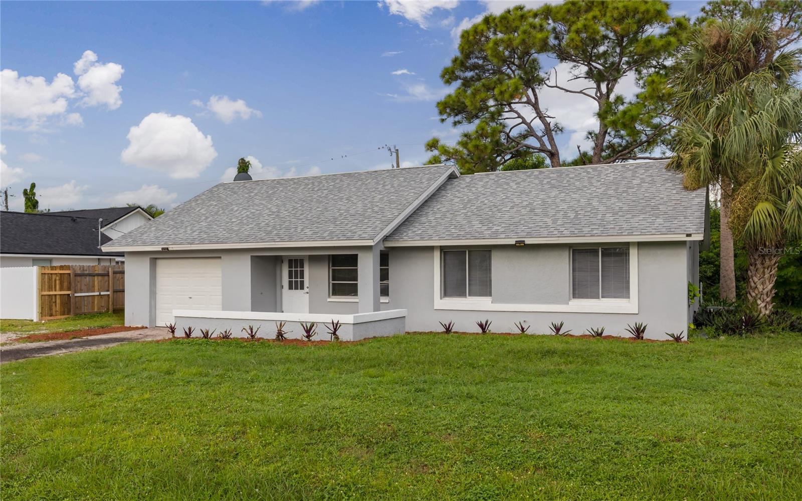 Completely remodeled 3-bedroom, 2-bath home with a 1-car garage offers a unique opportunity in booming Cape Coral. Located in Cape Coral’s unincorporated/ industrial/ Pine Island Corridor area, this property is zoned for both residential use and small business — ideal for investors or owner-occupants seeking flexibility of use and parking ability. The interior features new vinyl flooring throughout the main living areas, fresh carpet in the bedrooms, and updated paint inside and out. The kitchen has been completely refurbished with modern finishes and newer appliances. Additional updates include an extra-deep well with new equipment (property will not be subject to forced utility expansion according to the City of Cape Coral) and a roof replaced in 2019. Not located in a flood zone. Ideally located just off Pine Island Road, the property is within walking distance of shopping and dining