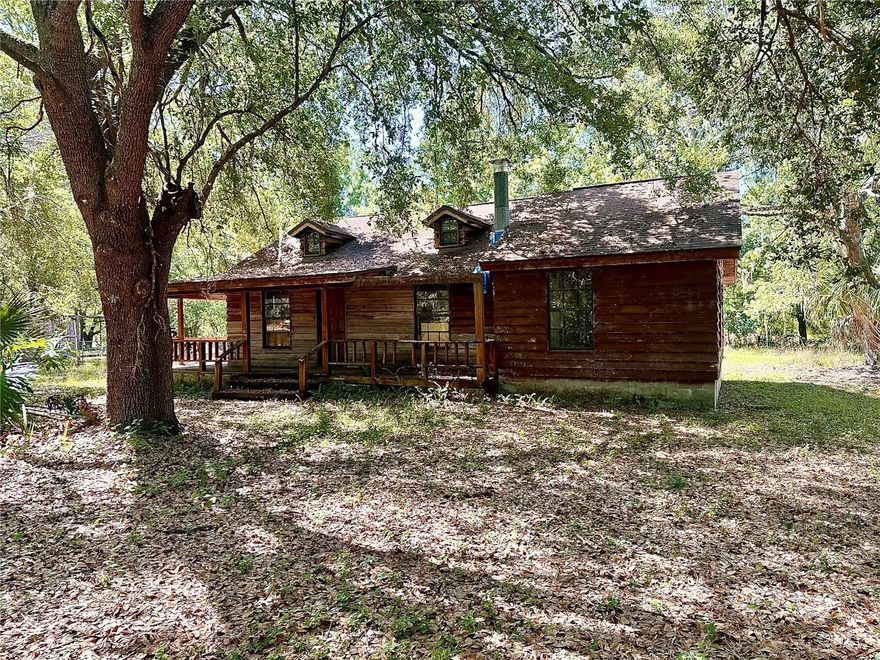 Charming cedar-sided cabin-style home in desirable Angus Valley! This 3-bedroom, 1-bath residence offers a warm and inviting great room with a cozy fireplace, perfect for relaxing or entertaining. Situated on a spacious half-acre lot, the property is fully fenced, providing privacy and room to enjoy the outdoors. Features include a large covered front porch, ideal for morning coffee or evening gatherings, and a convenient inside laundry area. Plenty of potential with space available to add a second bathroom. A unique opportunity to own a peaceful retreat with character and room to grow!