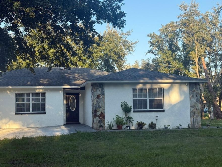 Experience country living with modern comfort in this 3-bedroom, 3-bath home on 2.17 acres in Plant City. Featuring a remodeled kitchen with solid surface counters, center island, and stainless steel appliances. Open floor plan with combined living/dining, porcelain tile, and luxury vinyl flooring. Primary suite with private bath. Enjoy a screened patio, outdoor kitchen, above-ground pool with deck, and a detached in-law suite/guest house perfect for visitors or a home office. Plenty of space for RV, boat, or multiple vehicles. Private well, no CDD, and conveniently located near I-4 for quick access to Tampa and Orlando.