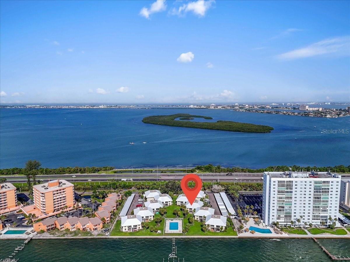 This fully renovated 2-bedroom, 2-bath waterfront residence at 7300 Sunshine Skyway Ln S, Apt 107, in Saint Petersburg, FL, offers expansive open-water views of Tampa Bay and an effortless living experience. Designed for comfort and convenience, the unit is fully furnished and move-in ready, just bring your toothbrush. Everything else is included, from linens and kitchenware to all utilities (electric, water, internet, and trash). The updated interior features high-end finishes throughout, with spacious bedrooms and modern bathrooms, making it ideal for professionals, relocating individuals, or anyone seeking a turn-key coastal stay.
Residents also enjoy access to a waterfront community pool, perfect for relaxing or soaking in the view after a day of work or exploration. Available for a minimum 30-day stay, this home is priced seasonally: $3,250 per month from May through November, and $4,000 per month from December through April. Discounts are available for multi-month bookings, with additional savings for stays of six months or longer. Reserved parking is included, and the building offers added amenities for convenience and comfort. Contact us for availability and extended-stay pricing.