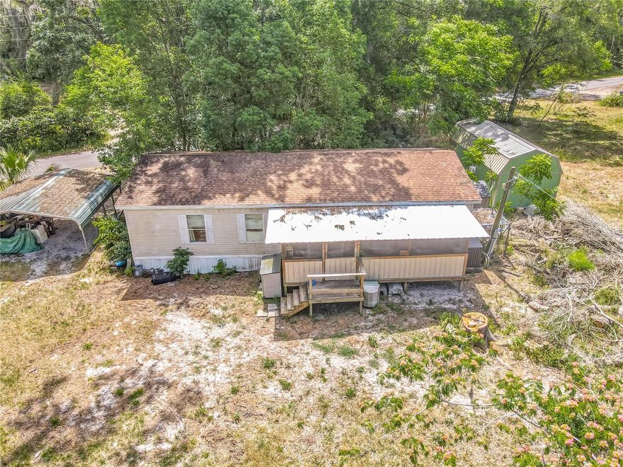 Opportunity knocks with this 3-bedroom, 2-bathroom manufactured home on .62 acres of B4-zoned mixed commercial property. Whether you're an investor, small business owner, or buyer with a vision, this property is full of potential. The home needs some TLC, but some important updates have already been taken care of; such as Roof (2019), well pressure tank and valve (2025), HVAC (2011).  It's on a well and septic, helping you save on monthly utility bills, and the septic was last pumped in 2022.  It had a structural foundation inspection with clean certification completed just in 2024.  The property also includes one shed (8'x10') and a carport for added storage and convenience.  This property is located just off S.R. 40 and Highway 17, with easy access to I-95 and a short drive to Ormond Beach or DeLand, this is a prime location with plenty of possibilities. Bring your ideas and make it your own!