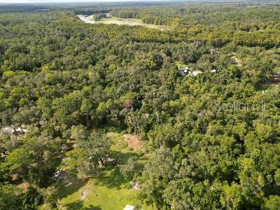 9 ACRES ON THE BIKE TRAIL! Need I say more? An insulated 2 car garage is ready for your cars, workshop, or hobbies. Seller is throwing in the red tractor on the property as well! This property is on a dead end street, so you won't be getting a bunch of traffic and noise. Partly cleared on the North end, with total privacy to the South. Deer and turkeys walk thru daily and make themselves at home. It's just off of Lake Lindsey, so access to Brooksville, Inverness, and I-75 is easy. Land like this won't be available forever, so get it while you can. They aren't making any more.