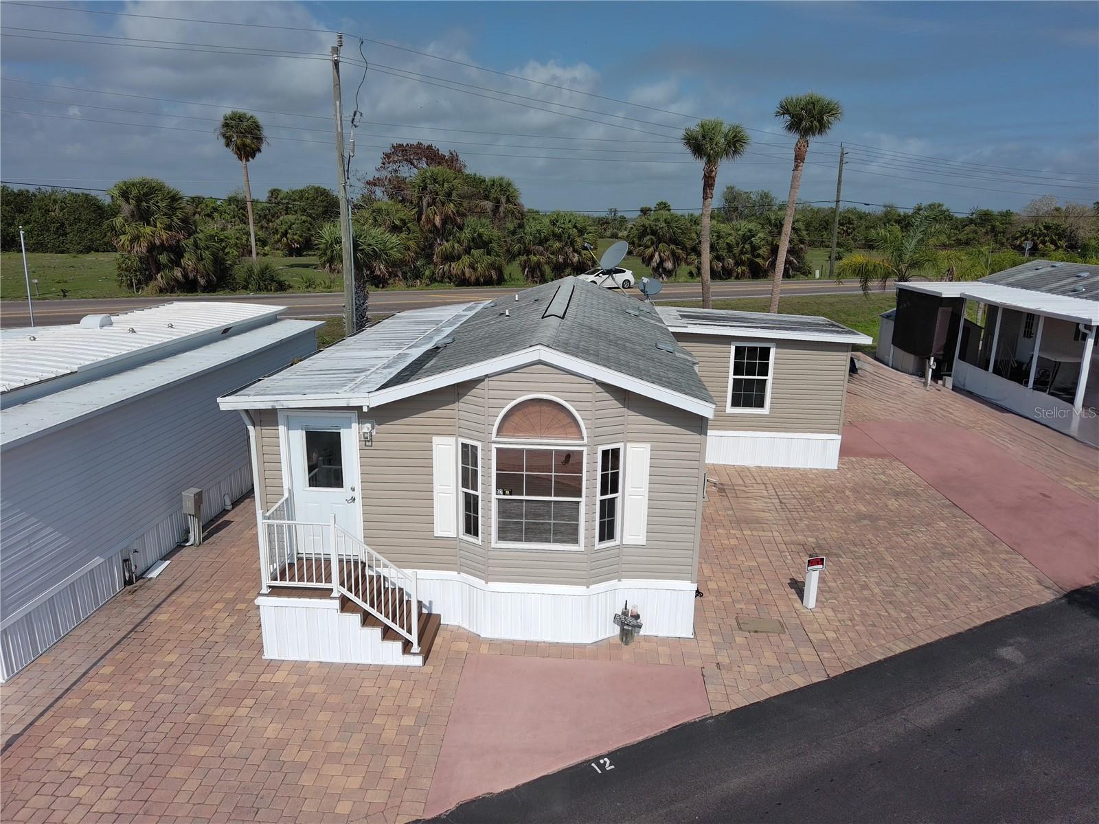 Wowza! Big O RV Park furnished home on DOUBLE lot with RV hookup. 2022 add-on upgrade of a larger bedroom w/dressing room featuring built-in closets w/mirrored doors. 2 large sheds one having electric and a freezer that conveys. No regrets living in this 55+ active community with tons of activities and amenities including bocce ball, cornhole, bingo, scheduled dinners, and the use of the clubhouse, recreation hall, boat ramp, fish cleaning station, laundry room & the spectacular sparkling heated pool! There's also additional storage on site available. The low HOA fee (inc water and sewer) makes this meticulously maintained community the most desired park in Okeechobee. Owner willing to also include the 2023 5th Wheel with a strong cash offer. This is the deal of a lifetime!