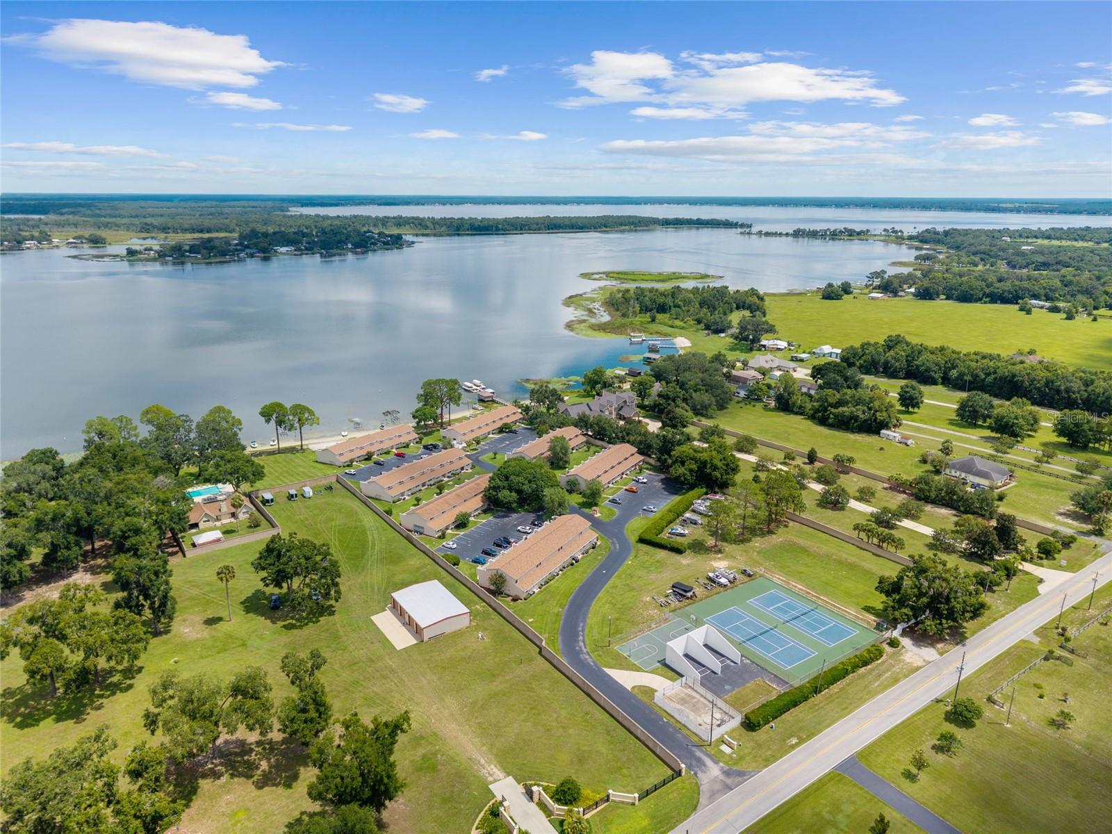 Are you looking for a tranquil escape? If so, your search ends here. This 2/1.5 Condominium has everything you need. Located directly on Lake Weir. Offers incredible space. Features a well-designed kitchen. Enjoy the beautiful views with loved ones. There are many other exciting details to discover. Schedule a showing today.