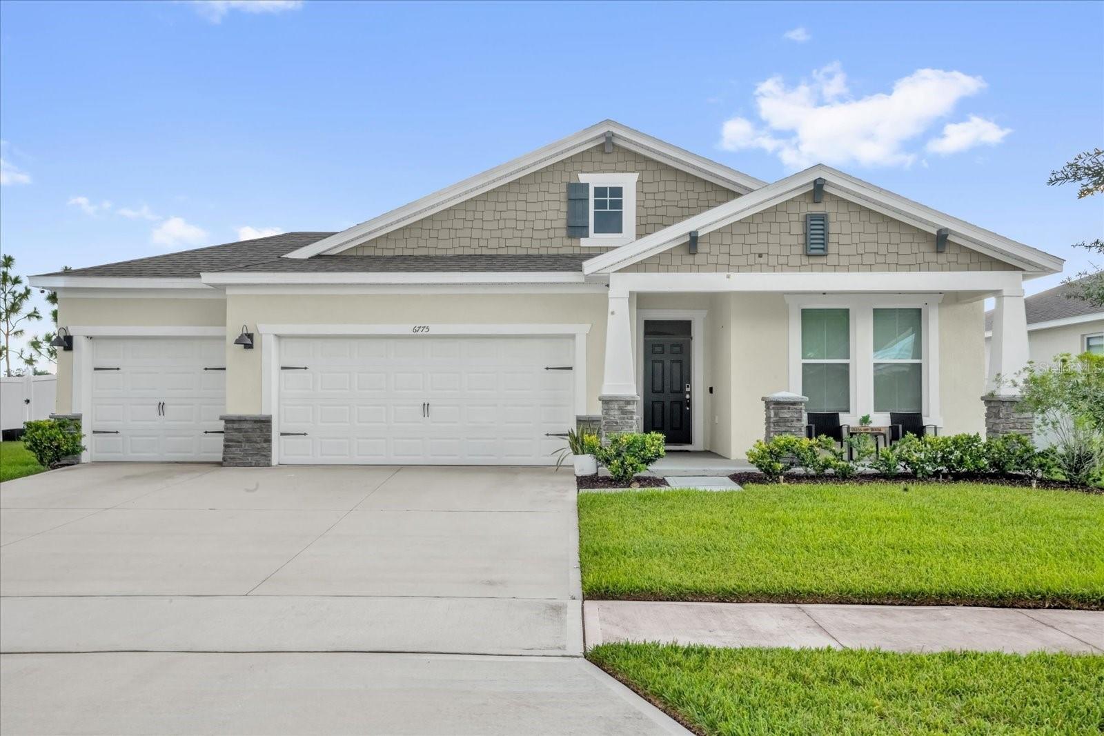 This beautifully designed 4-bedroom, 3-bathroom single-story home with a 3-car garage is located in the highly desirable Harmony West community of St. Cloud, FL. Built in 2021, it offers over 2,100 square feet of thoughtfully planned living space with a spacious open-concept layout. The modern kitchen features a large center island, granite countertops, stainless steel appliances, and a walk-in pantry, seamlessly connecting to the dining area and living room, perfect for entertaining or everyday living. The private primary suite is situated at the rear of the home and includes a generous walk-in closet and a luxurious bathroom with dual vanities and a tiled walk-in shower. Three additional bedrooms and two full baths provide flexible space for family, guests, or a home office. The home also features smart home technology, energy-efficient construction, and a covered lanai. The extended 3-car garage offers plenty of room for vehicles, storage, or a home gym. As part of the master-planned Harmony West community, residents enjoy resort-style amenities including a clubhouse, pool, fitness center, splash pad, and playground, all with low HOA fees and easy access to Lake Nona, top-rated schools, shopping, and major highways.