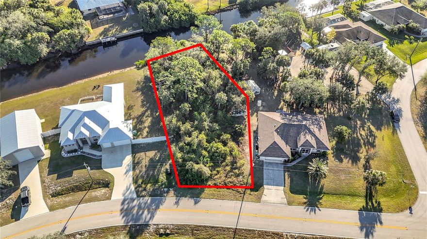 Exceptional oversized waterfront lot on the Como Waterway in Port Charlotte, offering easy access to Charlotte Harbour and the
Gulf with just two bridges to navigate. Spanning over 14,000 square feet, this lot features nearby city water and electric services. Imagine
enjoying sunny days boating, fishing, and sightseeing right from your backyard. Explore the Como Waterway to Manchester Waterway, leading you to the picturesque Peace River and Alligator Bay in Charlotte Harbour. With no HOA or CDD fees, this is a prime opportunity to build your dream home in a well-established Port Charlotte neighborhood. Ideally situated close to the Port Charlotte Beach Complex and the vibrant shops and restaurants of Fisherman’s Village in Punta Gorda. Plus, beautiful Boca Grande and Englewood/Manasota Key beaches  are just a short driveaway. Location, location, location!