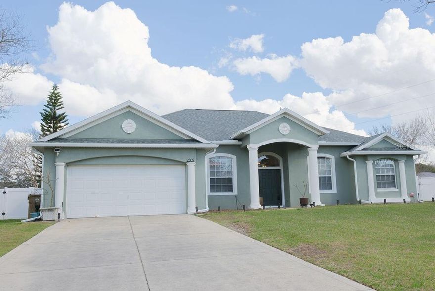 Welcome to this beautifully updated 4-bedroom, 3-bathroom single-family residence nestled in the heart of Mount Dora. Situated on a premium oversized lot with mature trees and a 6-foot privacy fence, this meticulously maintained home offers the ideal combination of comfort, functionality, and Florida lifestyle living. Freshly painted interior and exterior (2025), this well-maintained home features vaulted ceilings, formal living and dining areas, and a large family room that opens to the kitchen—ideal for everyday living and entertaining. The kitchen offers new granite countertops, tall cabinets, bonus counter space, a separate breakfast area, breakfast bar, built-in coffee station, stainless steel appliances (approximately 3 years old), and a spacious closet pantry. Large windows and sliding glass doors provide abundant natural light and seamless access to the paved lanai and fully fenced backyard, perfect for relaxing or hosting gatherings. The expansive primary suite serves as a private retreat with his and hers walk-in closets and sliding doors to the lanai, while the en-suite bath includes dual vanities, a soaking tub, walk-in shower, and private water closet. Additional bedrooms and baths provide ample space for family, guests, or a home office. Additional highlights include an inside utility room with laundry sink and cabinets, a 2-car garage, new roof (2025), new A/C (2025), and new gutters (2024). Conveniently located near shopping, dining, and local amenities, this home offers the perfect blend of comfort, space, and peaceful Florida living.