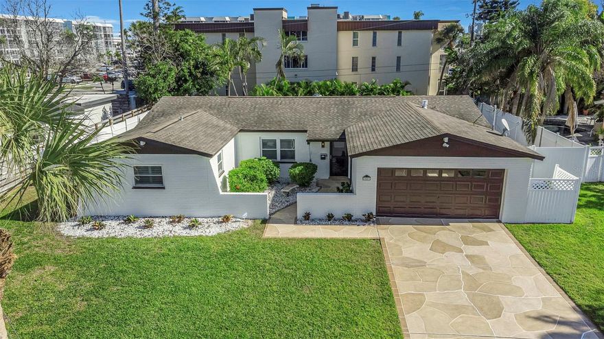 Get the key, unlock the door, step inside this completely REMODELED Maximo Moorings Home featuring a Whole House Natural Gas KOHLER Generator, and Hurricane Windows! The Maximo subdivision is located in the popular Skyway Marina District in the beautiful city of St. Petersburg and is within walking distance of Restaurants, including Tiki Docks and many others. Shopping is right around the corner including Publix, CVS, and other Retailers. The home is also centrally located and very close to downtown St. Pete, the Beaches, and major Airports. It is also located around the corner from Maximo Marina which has the largest covered boat slips in West Florida. Why not keep a home close to your boat? This side of St. Pete is a boaters paradise. The home is very close to award winning Elementary, Middle School, and High School(s). The kitchen is BRAND NEW and features all NEW STAINLESS STEEL APPLIANCES, including a GAS stove, BAR & WINE fridge, brand new custom cabinets with soft close drawers and Top tier FANTASY BROWN granite countertops. Brand new Washer & Dryer. This 3 bed 2 bath ranch has been remodeled from top to bottom with new epoxy garage flooring in the enclosed 2 car garage, plantation shutters throughout the entire home. The open concept floor plan is perfect for entertaining including a custom DRY BAR and Kitchen Island. The double French doors open up seamlessly from there to the 12x12 brand new patio with pavers where you can relax and enjoy your fully fenced in backyard. The Primary Bedroom has an ample sized custom closet and features an ensuite bath with a brand new double sink vanity, brand new fixtures, and a custom lighted mirror.  The split floor plan offers privacy with 2 additional bedrooms, one with a very large walk in closet. The secondary bath room features a brand new double sink vanity and brand new fixtures. The secondary bedrooms also feature generous closets all with custom closet systems. This beautiful home has plenty of room for RV and/or boat trailer storage  This home has all the conveniences you need and the perfect setting for making lasting memories.