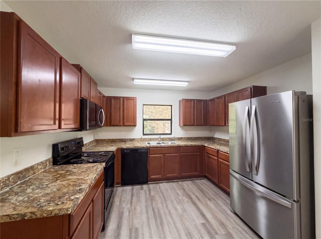 Photo of 2440 Bracknell Forest Trail, Tavares, FL 32778 (MLS # O6401822)