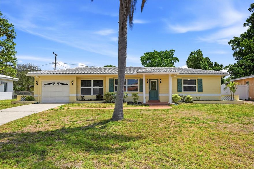 Charming two bedroom, one bath home with an attached one car garage, set on a generously sized beautifully landscaped lot. The home has been thoughtfully updated with newer windows and a refreshed kitchen featuring custom white cabinetry, stone countertops and stainless steel appliances. Bright and functional layout with a versatile bonus room off the living area ideal for a family room, home office or flex space. Interior has plenty of natural light. Well maintained and move-in ready for immediate occupancy. Enjoy the outdoors year-round from the spacious screened patio, perfect for relaxing or entertaining while enjoying the large backyard perfect for BBQs and gatherings. Conveniently located in a quiet friendly neighborhood near shopping, dining and schools, with an easy drive to the Gulf Beaches and Downtown St Petersburg. Come and see this amazing home today and make it yours tomorrow!