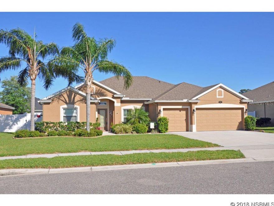 Immaculate home with lots of upgrades.  Ideal floorplan for large family or in-laws with master suite & office on one side & second suite & additional bedrooms & bath in separate wing.  Kitchen features extensive granite counters & bar, large custom-fitted pantry, upgraded stainless appliances including convection oven & lots of added lighting.  Adjoining breakfast nook & family room provide lots of gathering space for entertaining.  Built-in speakers in family room & living room.  Crown molding in family, living & dining room.   Office adjoins master suite & makes ideal sitting/sewing or nursery.   Dual walk-in closets & garden tub in spacious master bath.  Natural gas for cooktop & tankless water heater & quick connect for grill.  Oversized 3 car garage with pull-down aluminum stairs to access attic storage.   Double-paned windows.  Hurricane shutters for all windows & doors.  Reclaim water for inexpensive lawn irrigation. Surge protection on HVAC.  Security system.  In-wall pest control.  USB ports in kitchen & master suite.  Samsung washer/dryer convey. ;Water: City